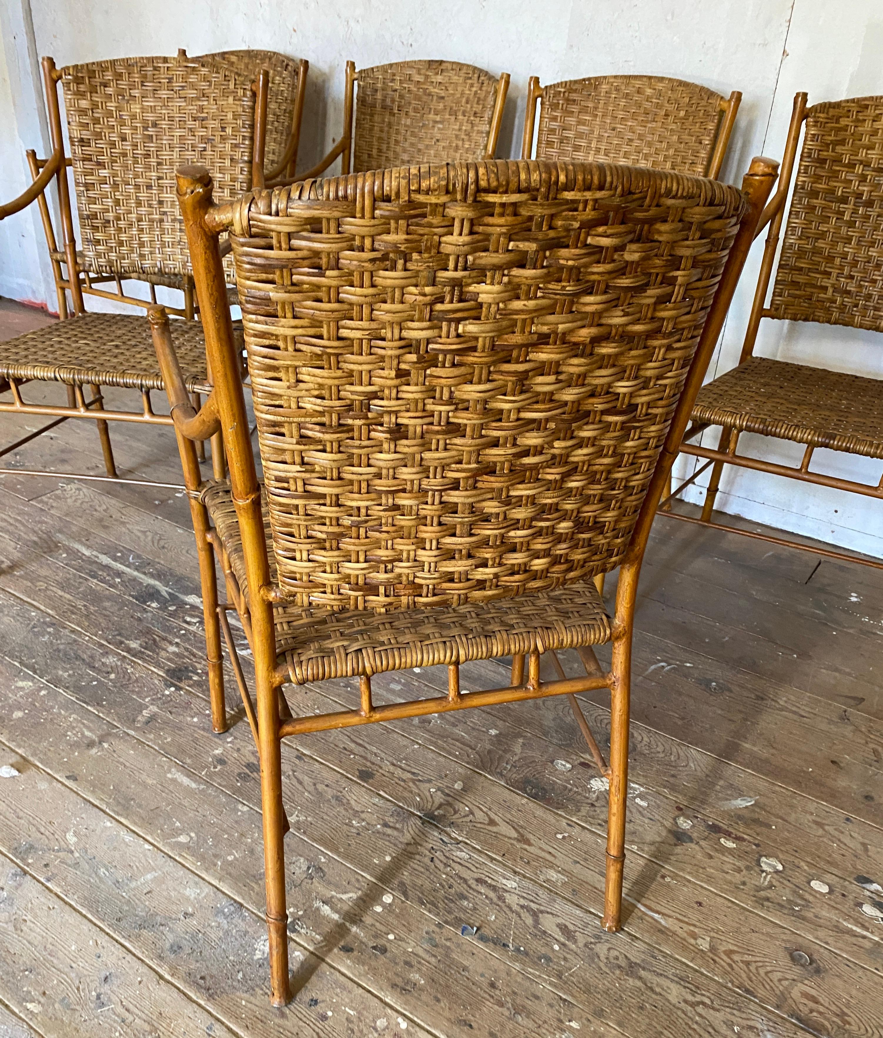 Set of 6 Mid-Century Modern dining arm chairs with great styling and comfort. The chairs are made with faux painted metal frames and woven rattan seats and backs. Use it in the dining room, kitchen table or patio or porch.
Arm height = 27