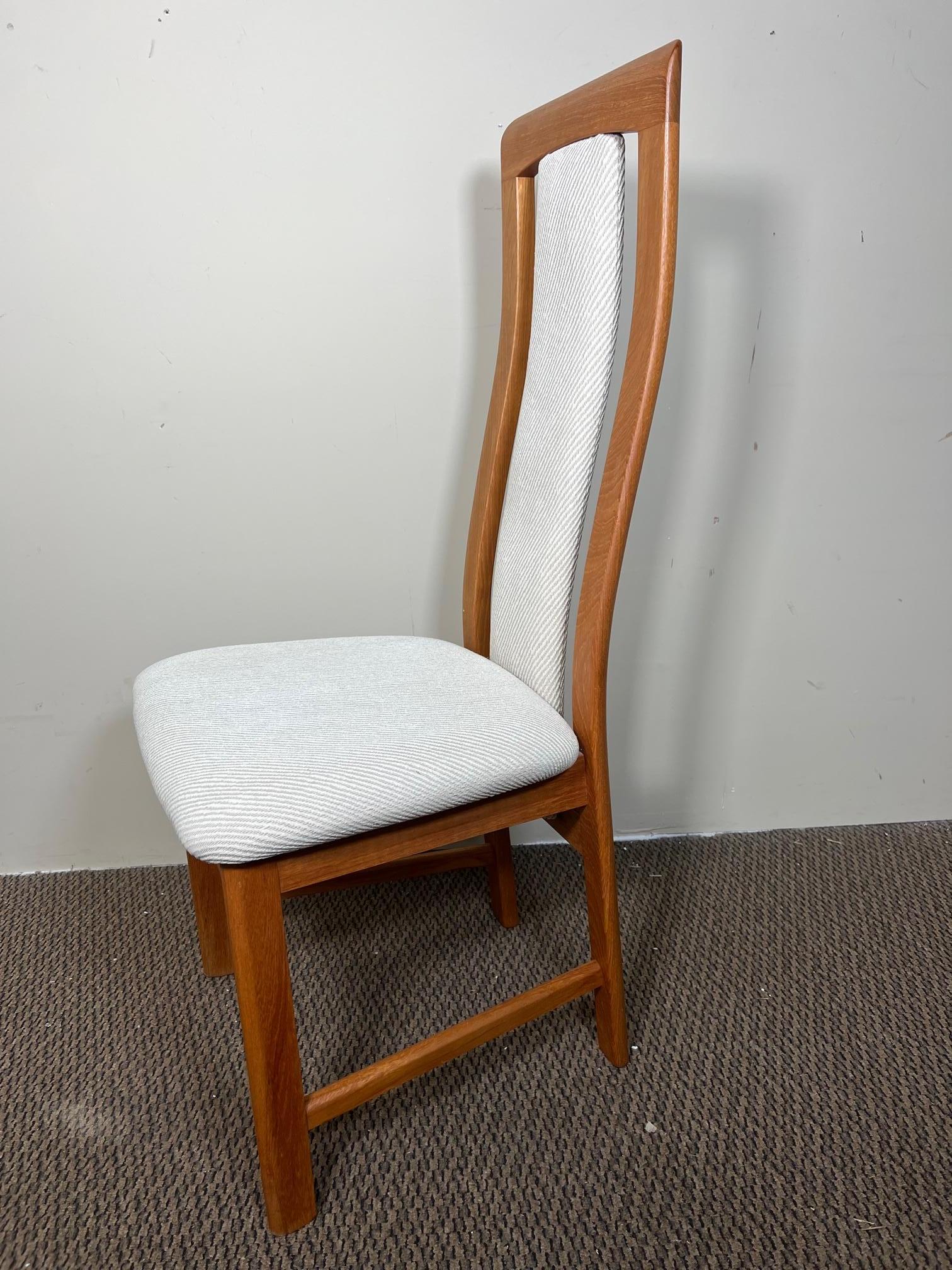 Beautiful set of 6 midcentury Danish Modern teak dining chairs with padded fabric back. Made by Nordic Furniture, Markdale Ontario Canada. Stamped underneath.

Very good condition. All the chairs are very sturdy. Upholstery appears to be original.