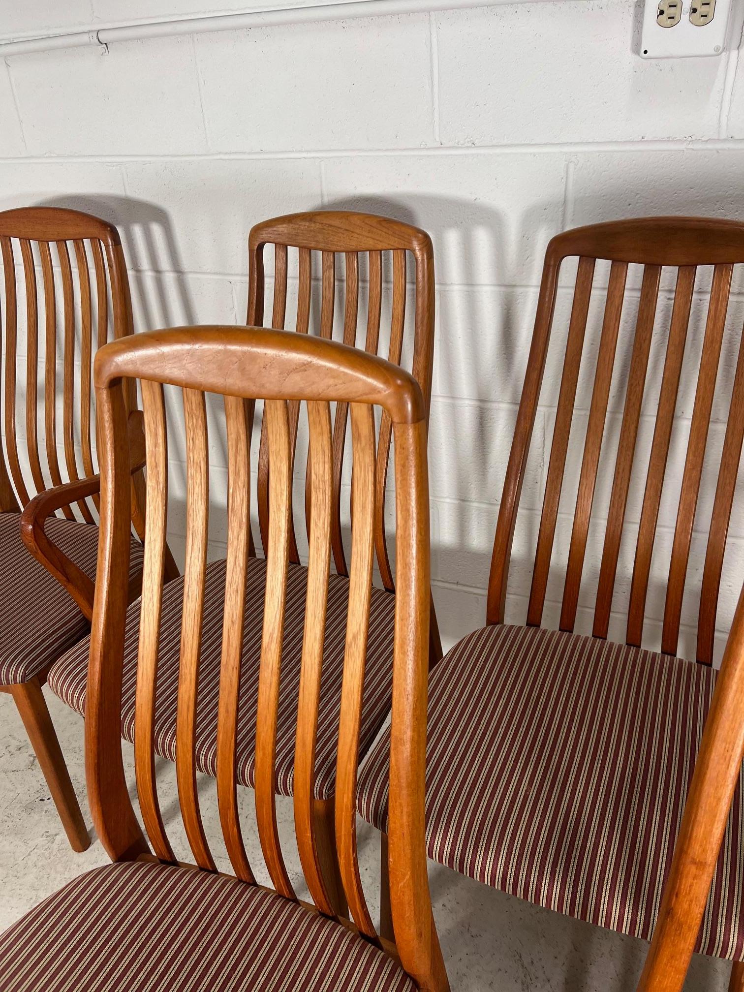 Fantastic set of 6 teak dining chairs by Schou Andersen. Made in Denmark.

Including two with arms. Excellent condition. Minor marks on the teak frames. Very sturdy. Small spot on one of the seats. Scratch on the top of the back rest on one