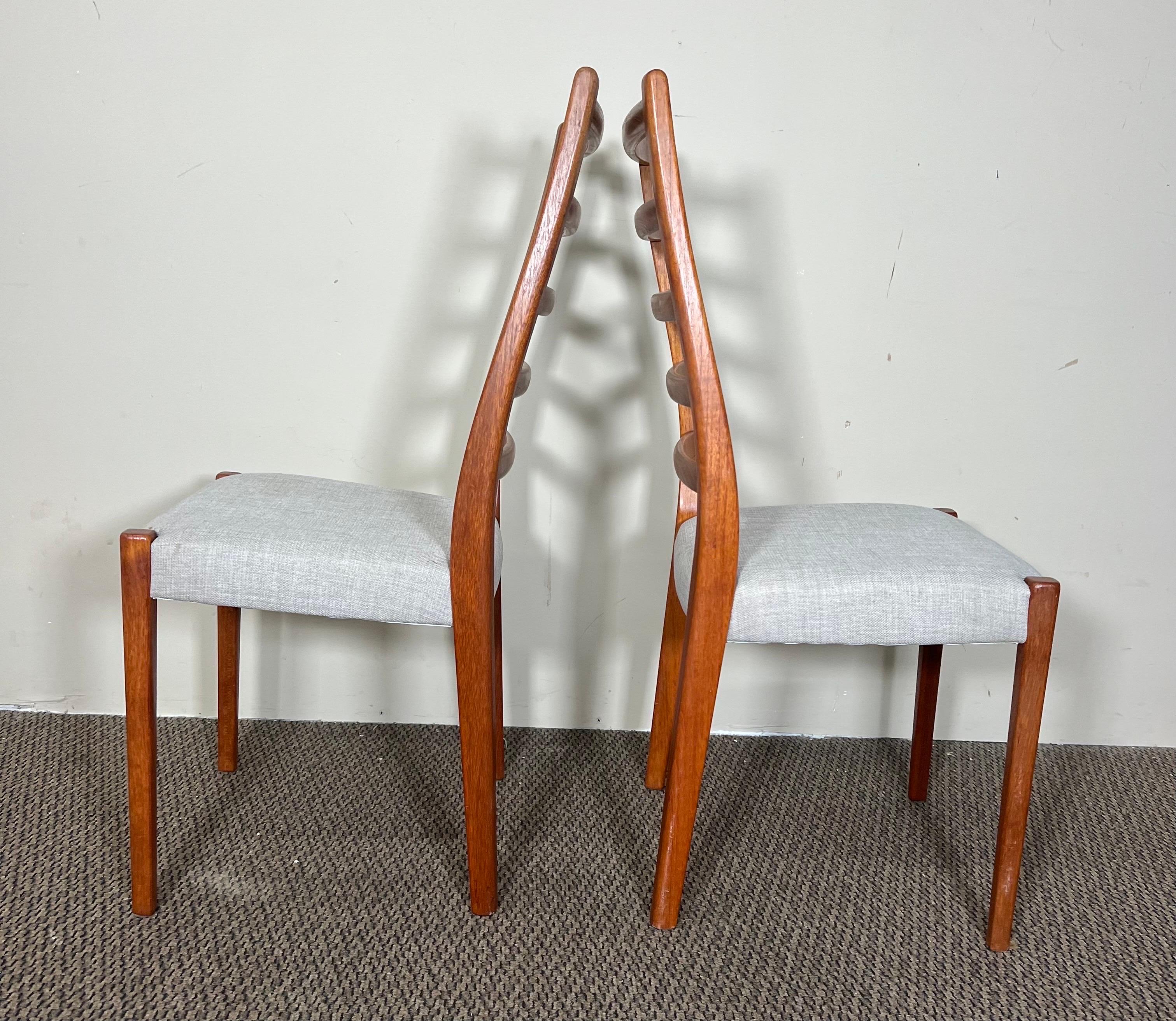 Gorgeous set of 6 ladder back teak dining chairs. Made by Svegards of Sweden. Teak frames with gray fabric seats. Recently reupholstered. 
Dimensions: 18” x 15.5” x 37.75” W x D x H
Seat height 18”
Very good condition. Some light scuffs and marks