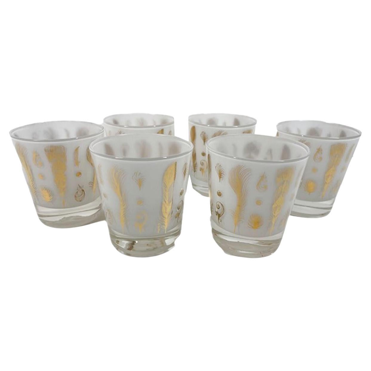 Six mid-century old fashioned glasses designed by Fred Press with 22 karat gold feathers on clear glass with frosted white interiors.