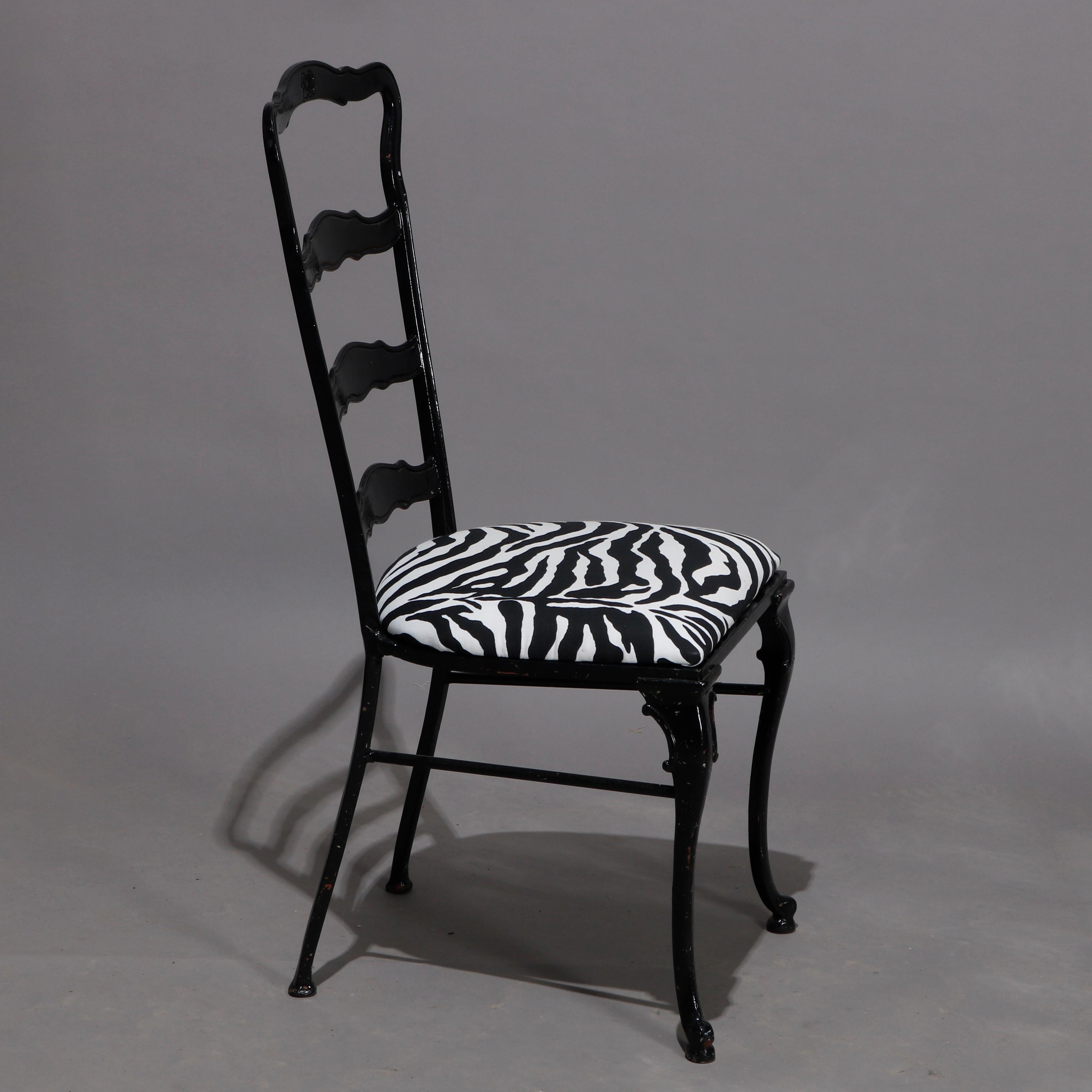 A set of six Mid-Century Modern dining chairs offer ebonized black metal frames with tall ladder backs surmounting black and white zebra animal print upholstered seats, elements of Hollywood Regency, 20th century.


Measures: 43