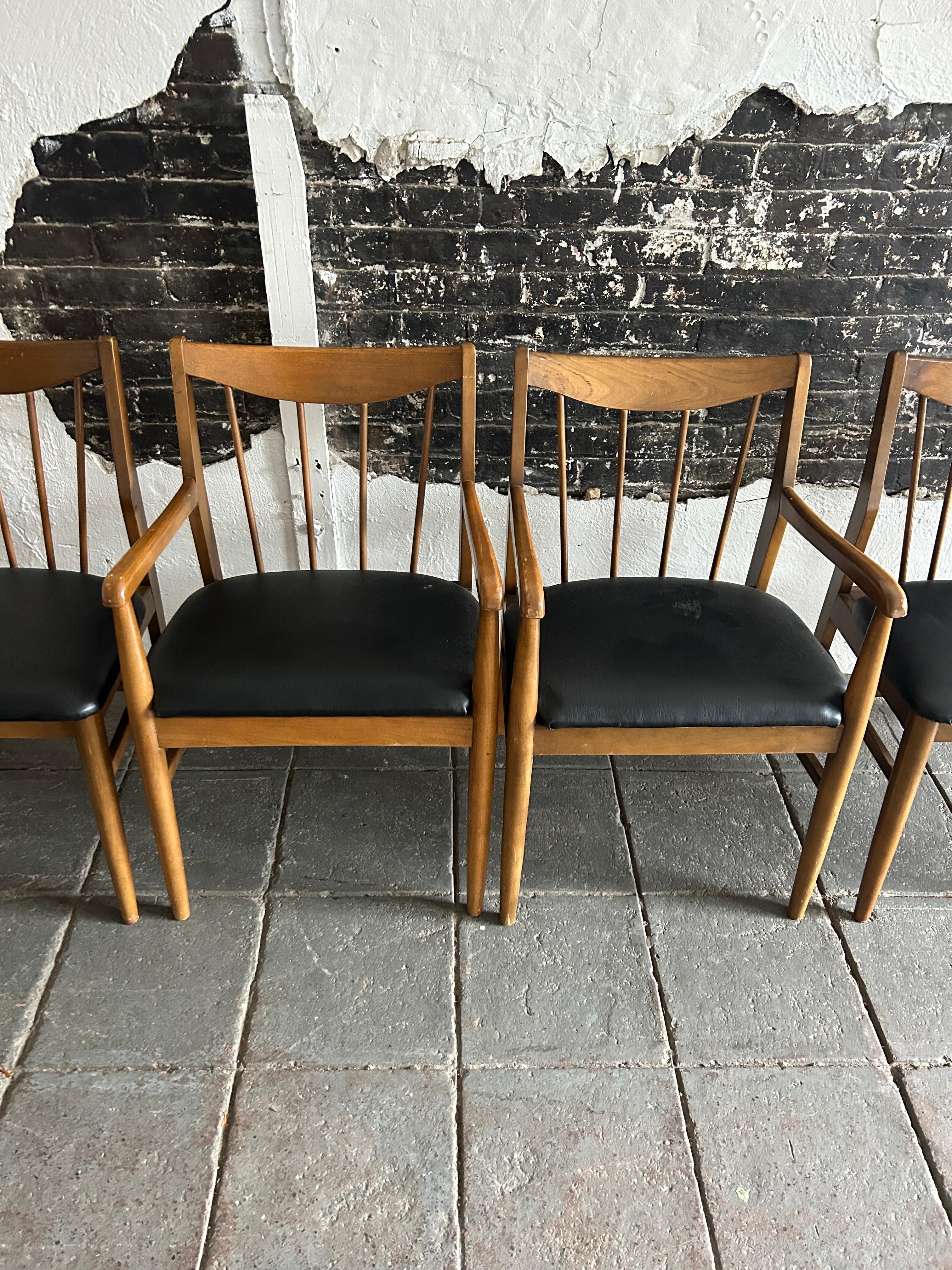 Naugahyde 6 mid century spindle back American modern walnut dining chairs black vinyl For Sale