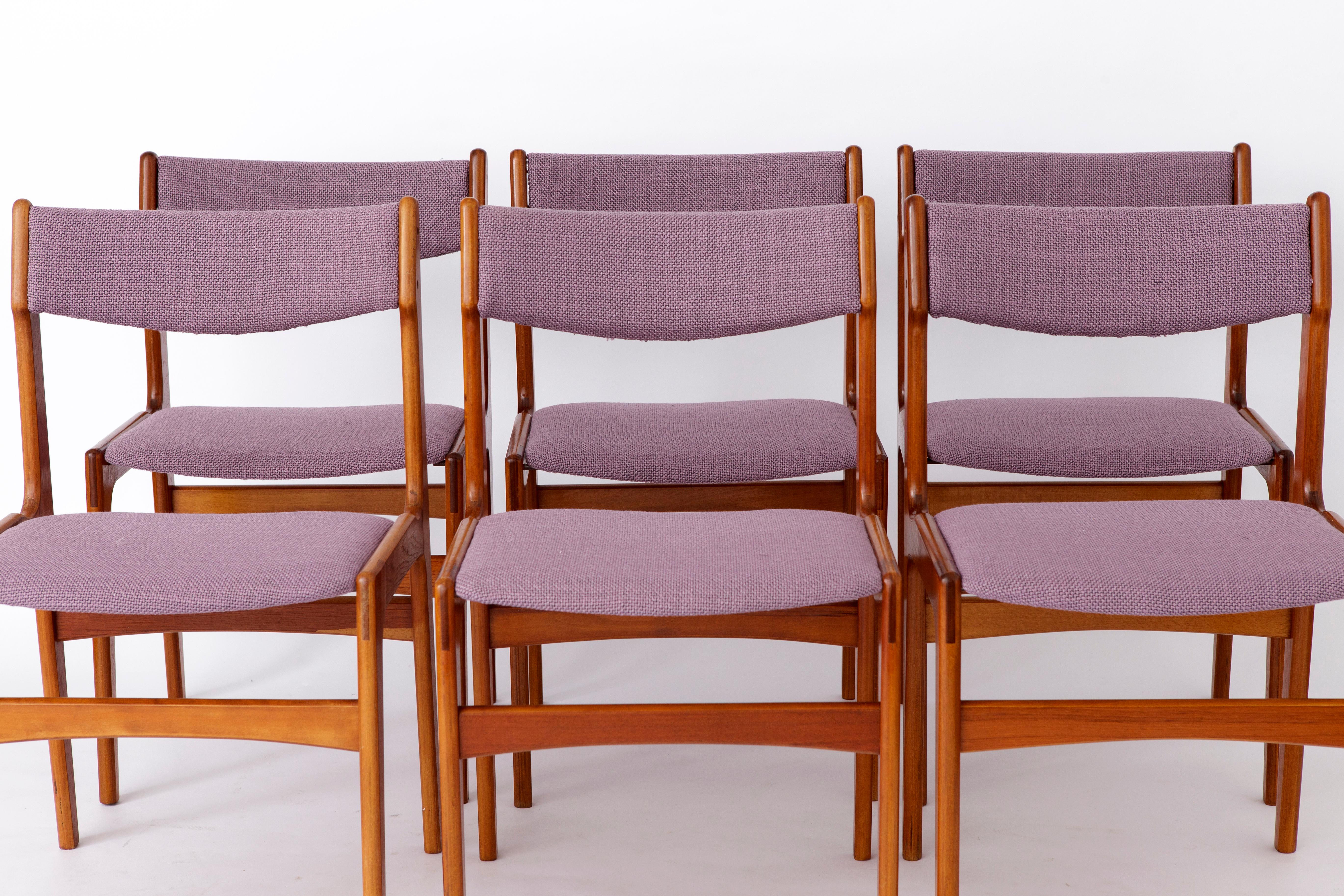 Set of 6 vintage dining chairs from the 1960s. 
Unknown producer.  
Displayed price is for 6 chairs. 

Good condition of all chairs. 
Teak wood frames were refurbished and oiled. 
Seat and back covers were reupholstered with purple textile. 
Chairs