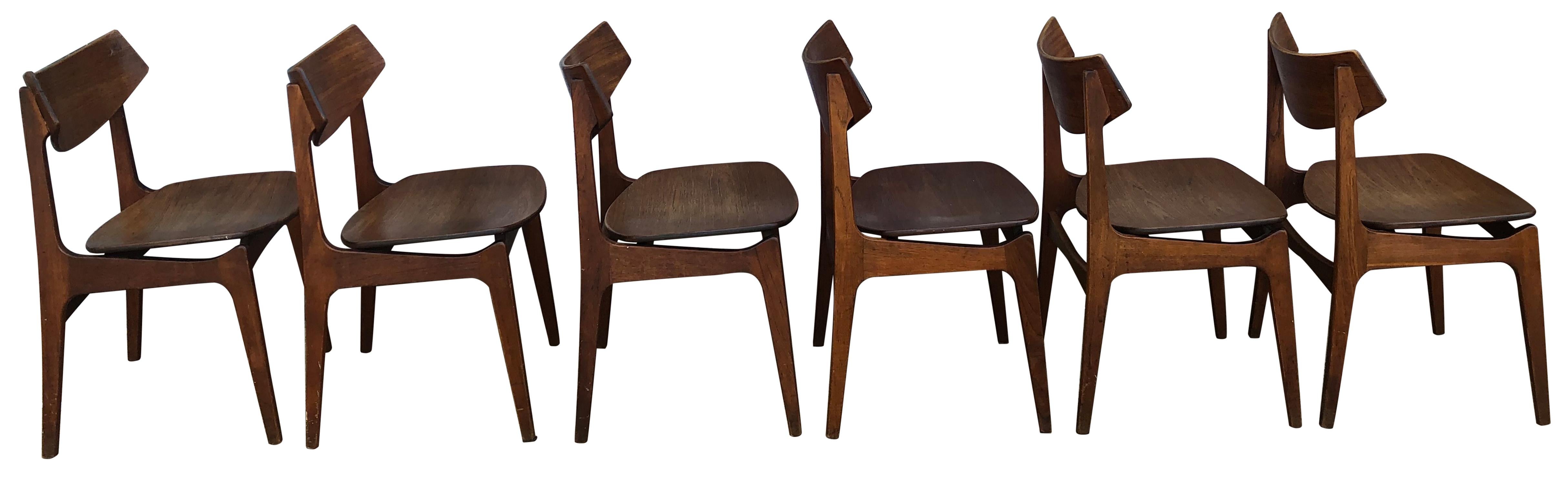 Beautiful teak wood dining chairs for Funder-Schmidt & Madsen designed by Erik Buch. This listing is for (6) chairs (1) set. Great Danish design. (1) chair has a repair to the back rest. All chairs are in original vintage condition. These chairs are