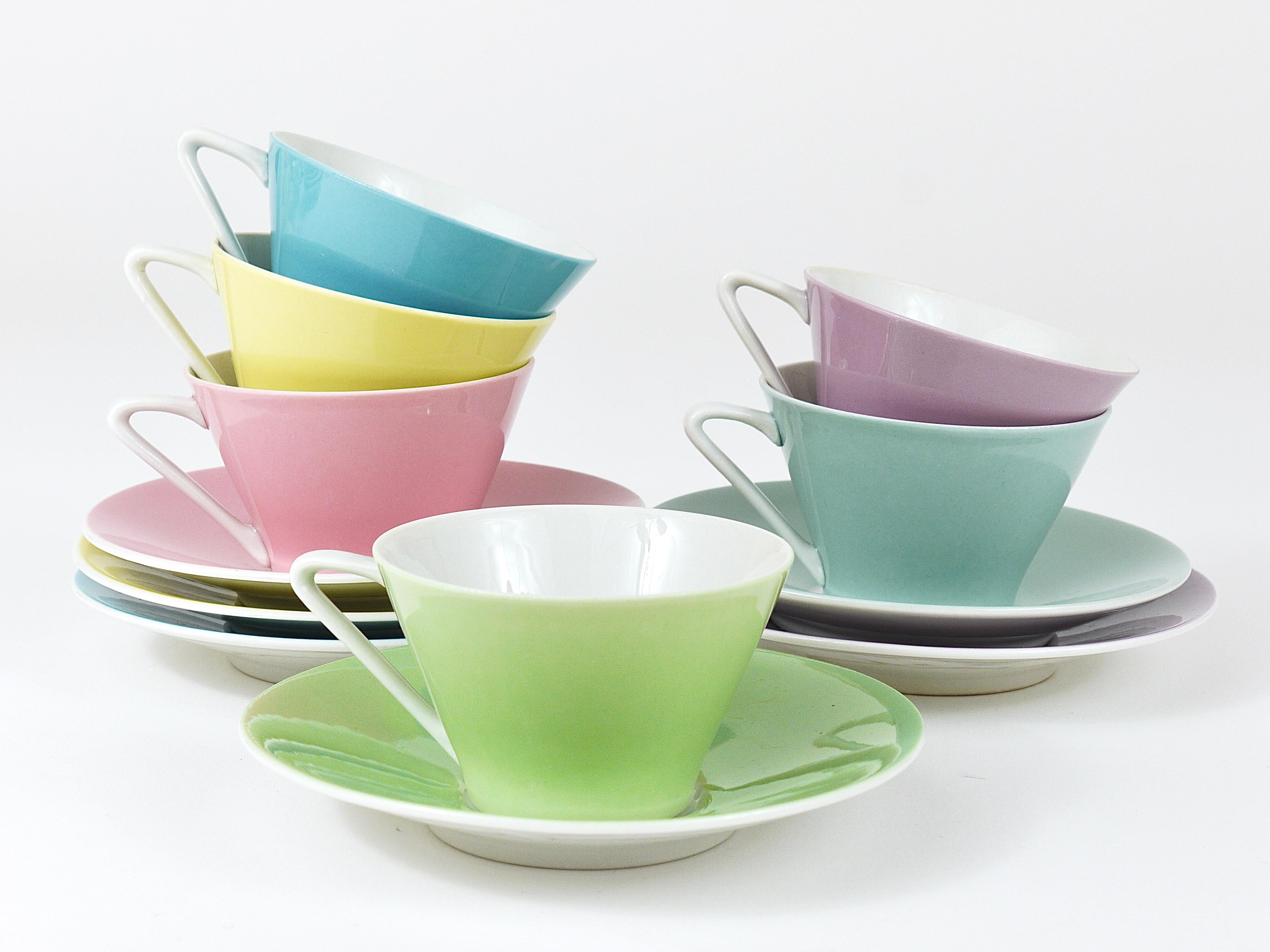 A mokka set of six charming conical espresso coffee cups and saucers from the „Daisy“-series, made of thin, fine china in six different lovely pastel colors, yellow, light blue, light green, bluegray, pink/rosé and lilac. Made in the 1950s by Lilien
