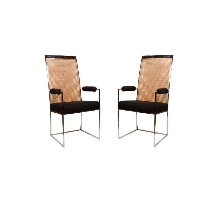 Gorgeous dining chairs designed by Milo Baughman for Thayer Coggin. The simplistic high back chrome frame is softened by the original inset panel of caning. The set consists of four side chairs and two armchairs with upholstered arm rests. Recently