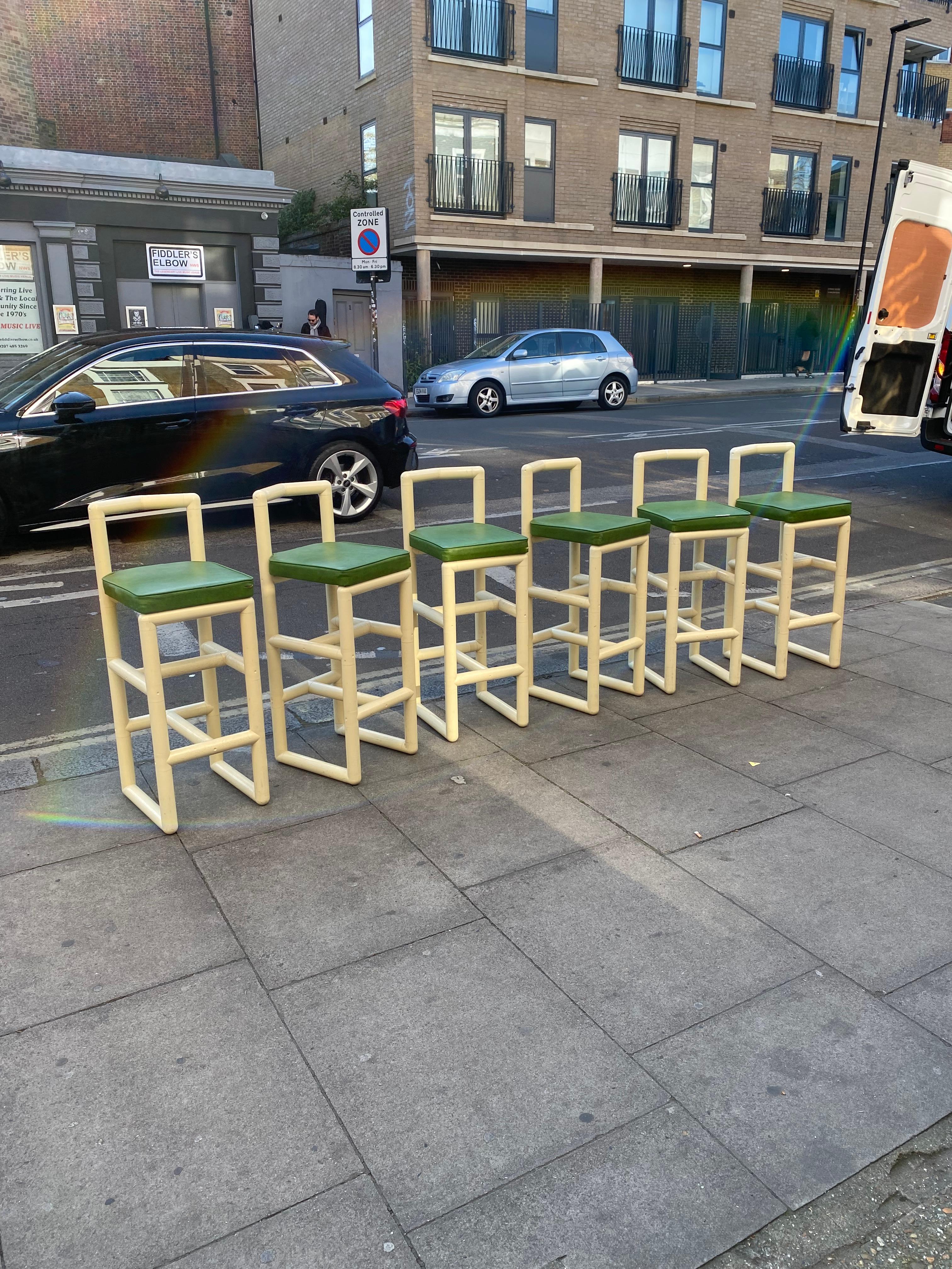 A stunning set of six 1970s bar stools build from tubular acrylic pipe-like frame making them the ideal stools to have by the swimming pool!  
The bold frames have a backrest which hags the back when seating on the square seats. The seats are