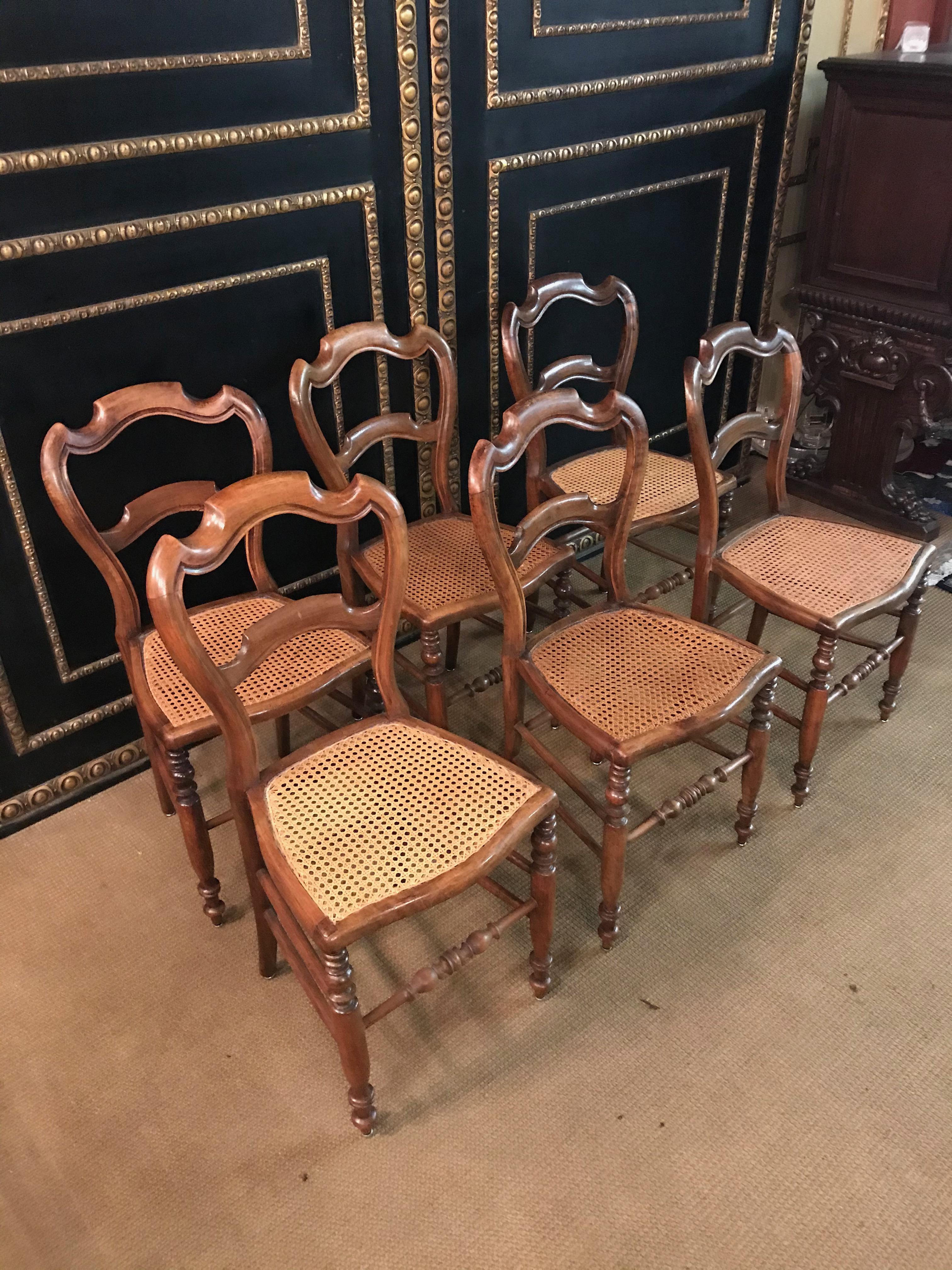 A rare set of 6 antique Biedermeier chairs / café house chairs / bistro chairs made of solid mahogany wood.
The seats of the chairs are made of intact straw,
the backrest has a curved shape.
The legs are connected with struts.
Dimensions.
Width