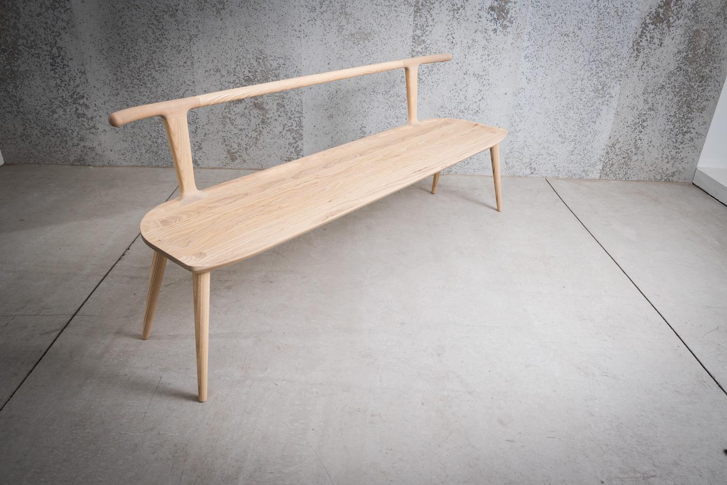 This entryway bench, designed by Justin Nelson for Fernweh Woodworking, evolved out of the Oxbend dining chair, leading also to a matching bar stool. The Oxbend Collection was born from a desire to create seating that is comfortable, organic, and