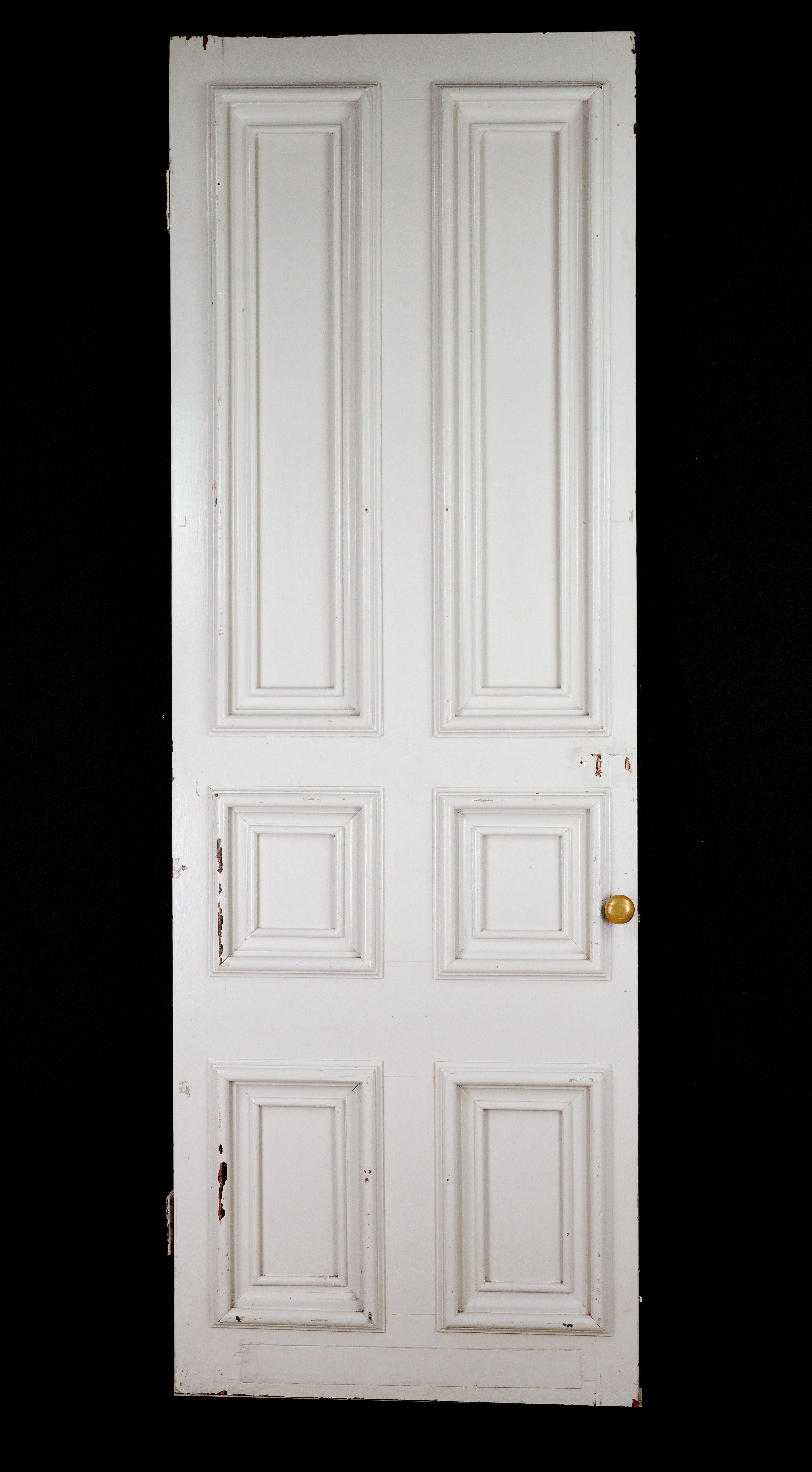 The antique white pine passage door features a classic design with a vent at the bottom, ensuring proper airflow and maintaining an elegant six double panel appearance. This is ideal for enhancing any interior space. Minor surface wear. Please note,