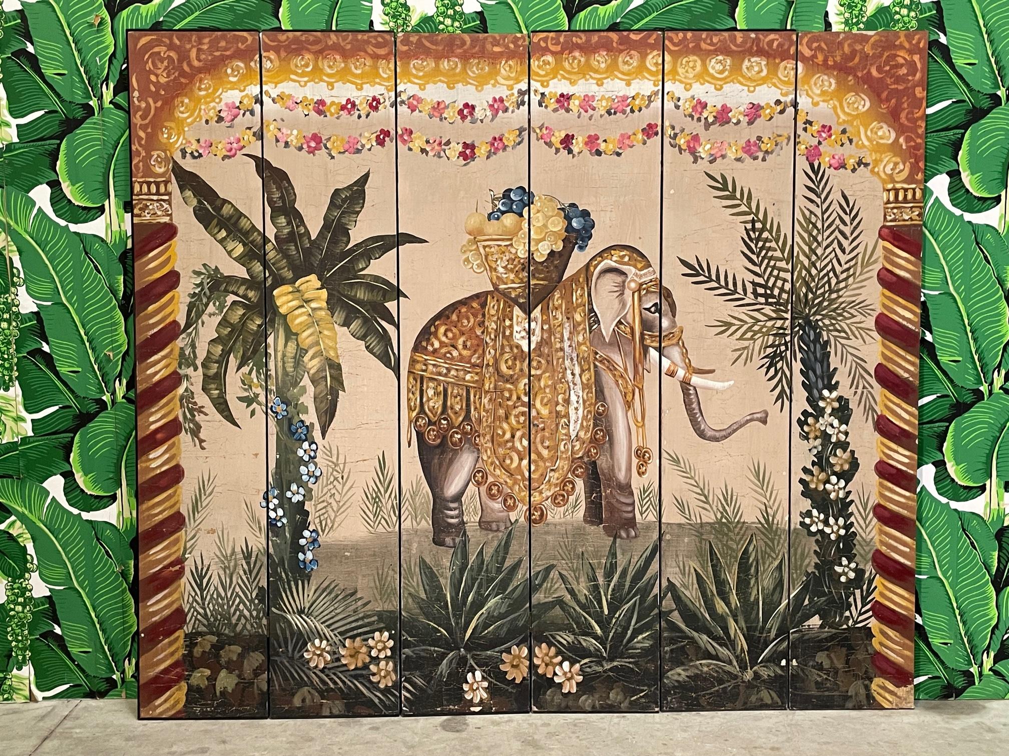Early to mid-century era six panel folding screen features a hand painted scene depicting an elephant in full regalia as well as palm trees, flowers, and twisted columns. Believed to be Indian or East Asian in origin. Good vintage condition with