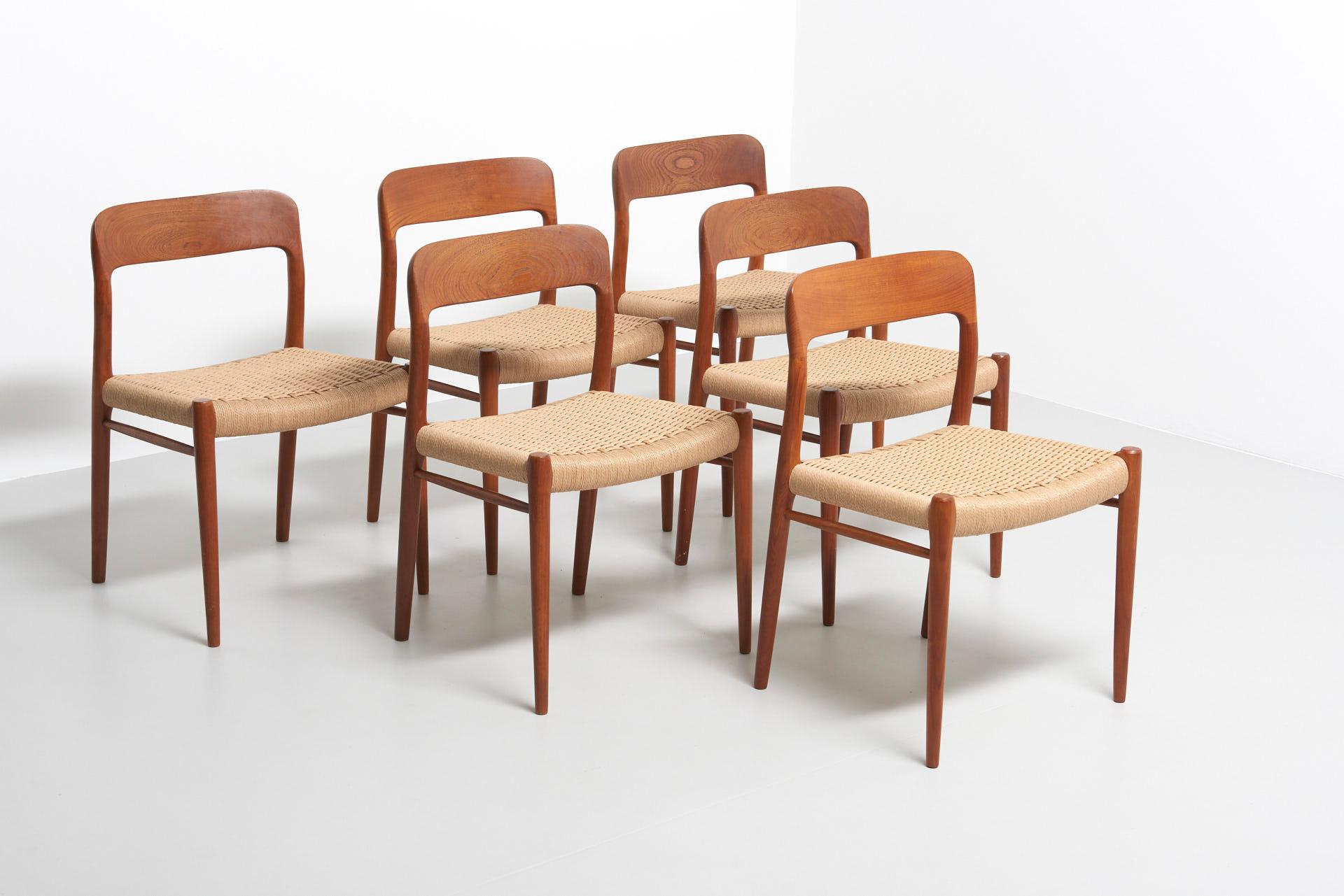 Set of 6 dining chairs in teak with carved backrests. Design by Niels O. Møller in 1954. Made by J.L. Møllers Møbelfabrik in Denmark. The set consists of 6 model 75 side chairs with new papercord seats.