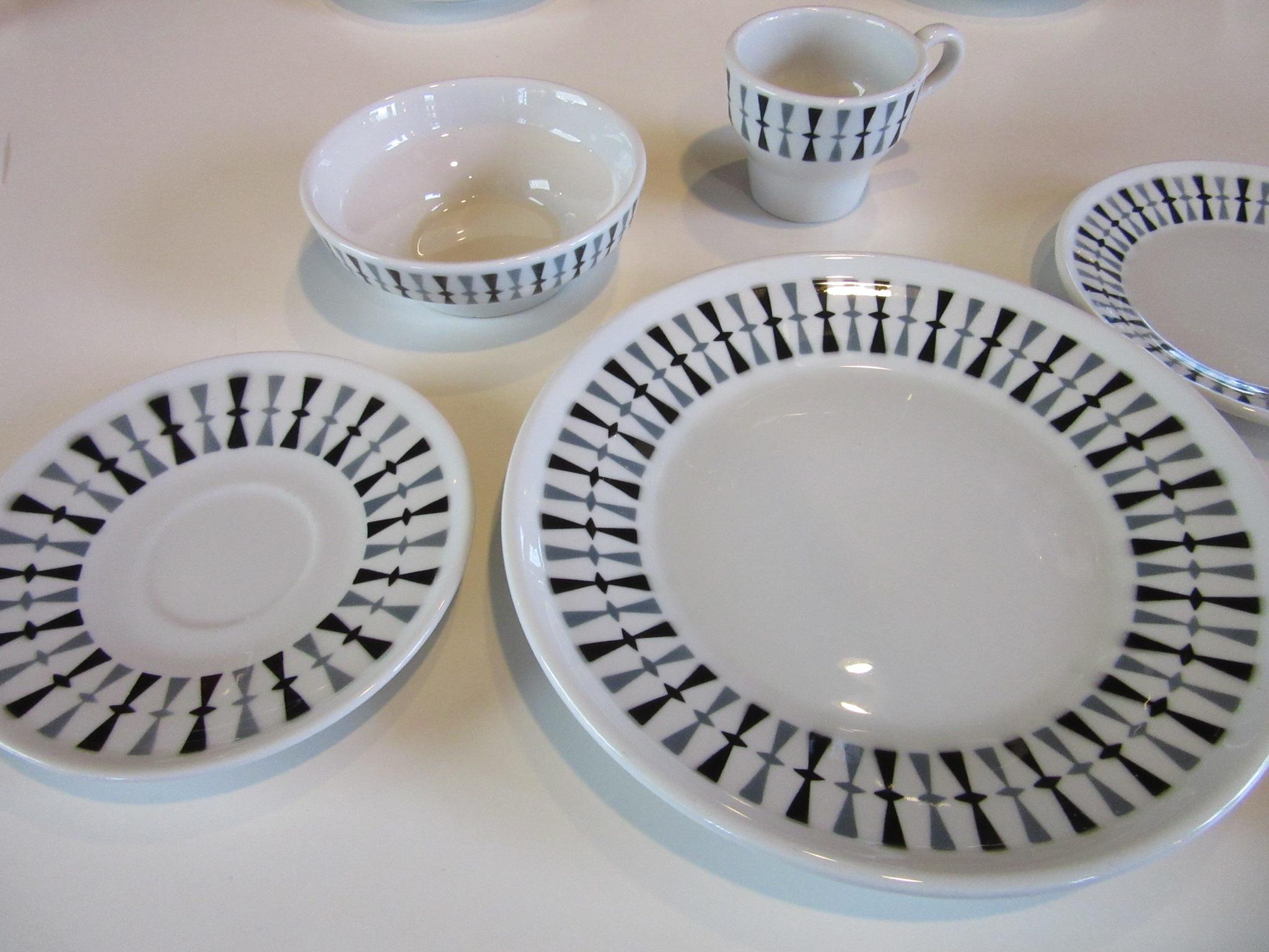 A fine 36-piece midcentury China set with six 6-piece place settings designed by Paul McCobb with dark gray and black graphics produced in 1959-1960. The china is in a restaurant style which means it a heavier form and dish washer safe, retains the