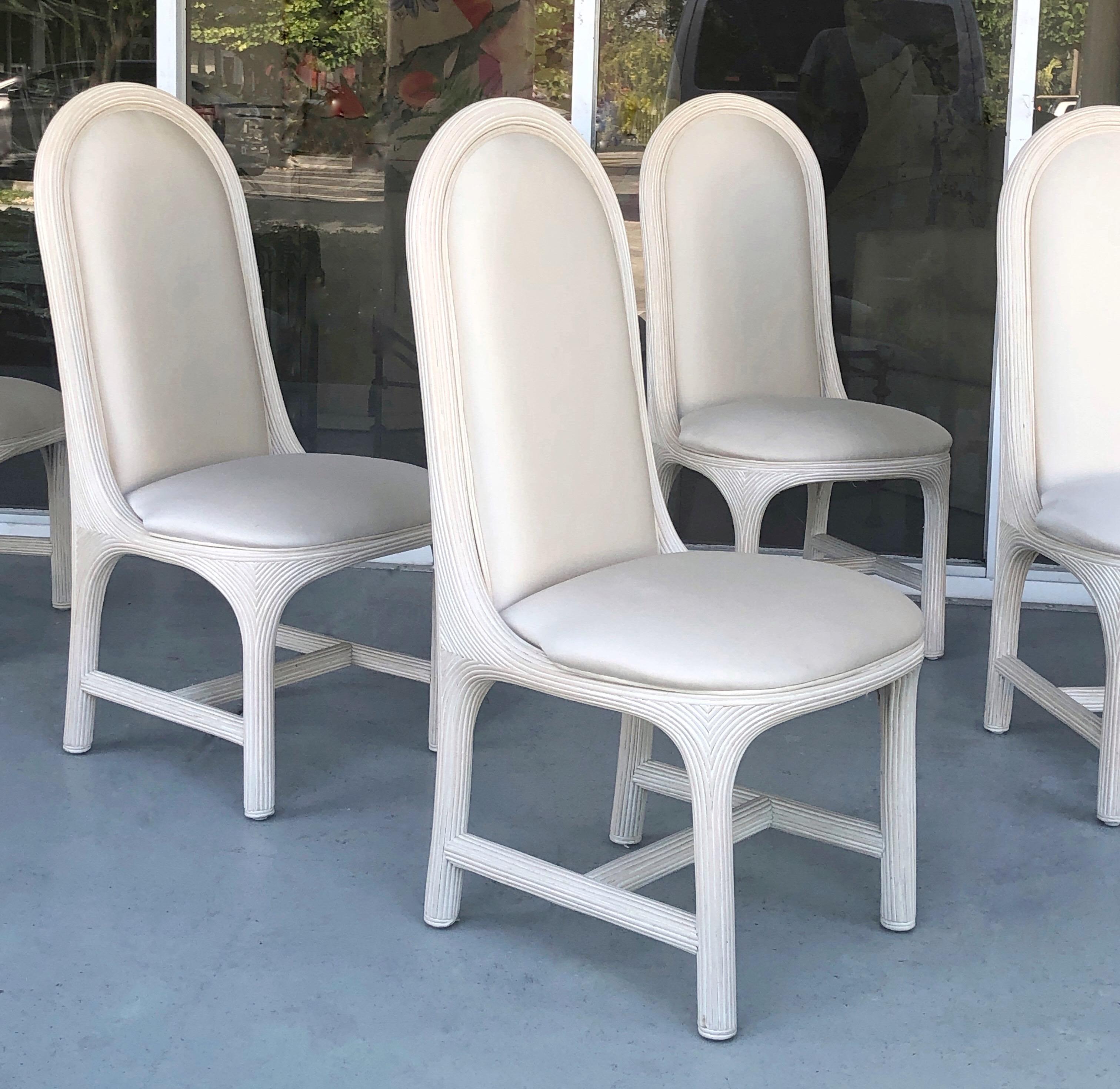 A set of elegant understated dining chairs. Bold and harmonious design. Meticulously crafted. Off-white color is not a wash nor a painted finish, somehow in between.