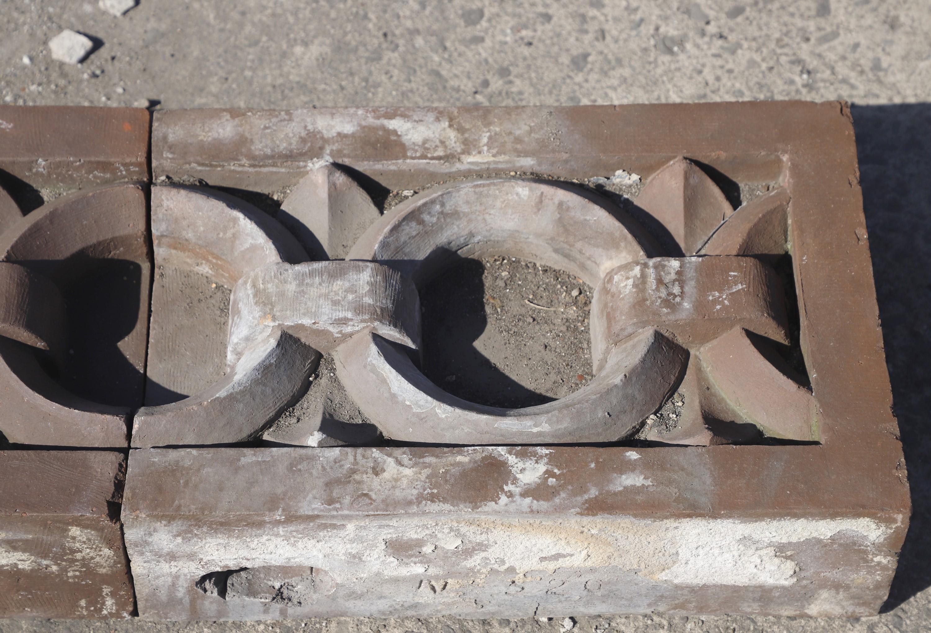 Early 20th century NYC building façade terra cotta stones. These feature a Greek letter Theda chain-like design. With original patina. Priced as a set of six. Please note, this item is located in our Scranton, PA location.