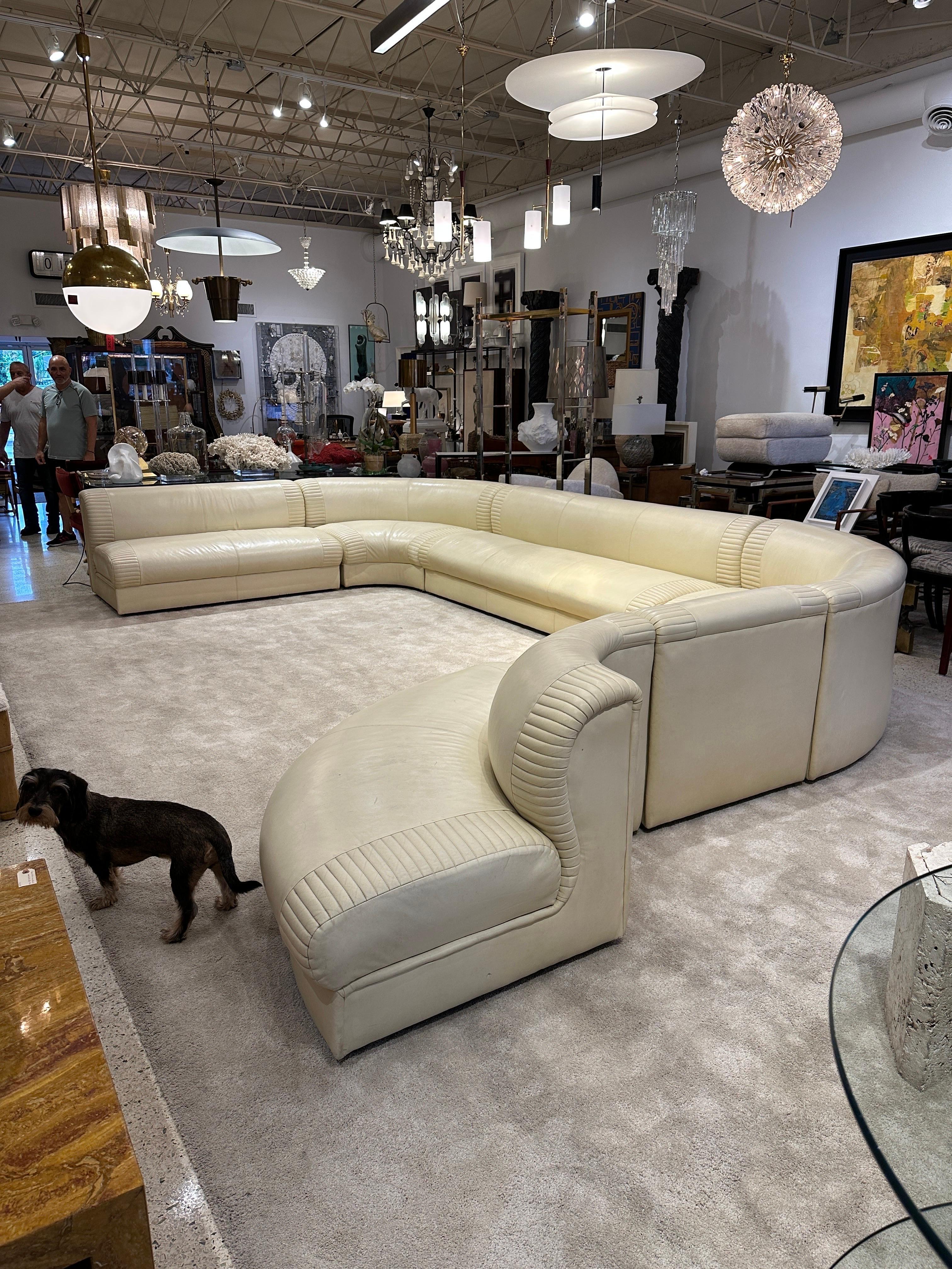 This is an INCREDIBLE 6 piece sectional sofa in buttery soft vanilla tone leather made by Weiman. The dimensions AS SHOWN: 203 inches wide, right side depth (front to back) is 130 inches, left side depth is 116 inches. Obviously, can be configured