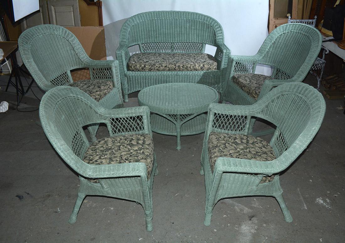 Wonderful set of vintage wicker sofa and chair set consisting of small sofa or loveseat, 2 rockers, 2 arm chairs and a matching round coffee table. Search terms -- rattan. Set can be broken up. 

Sofa - Seat height 15.75
