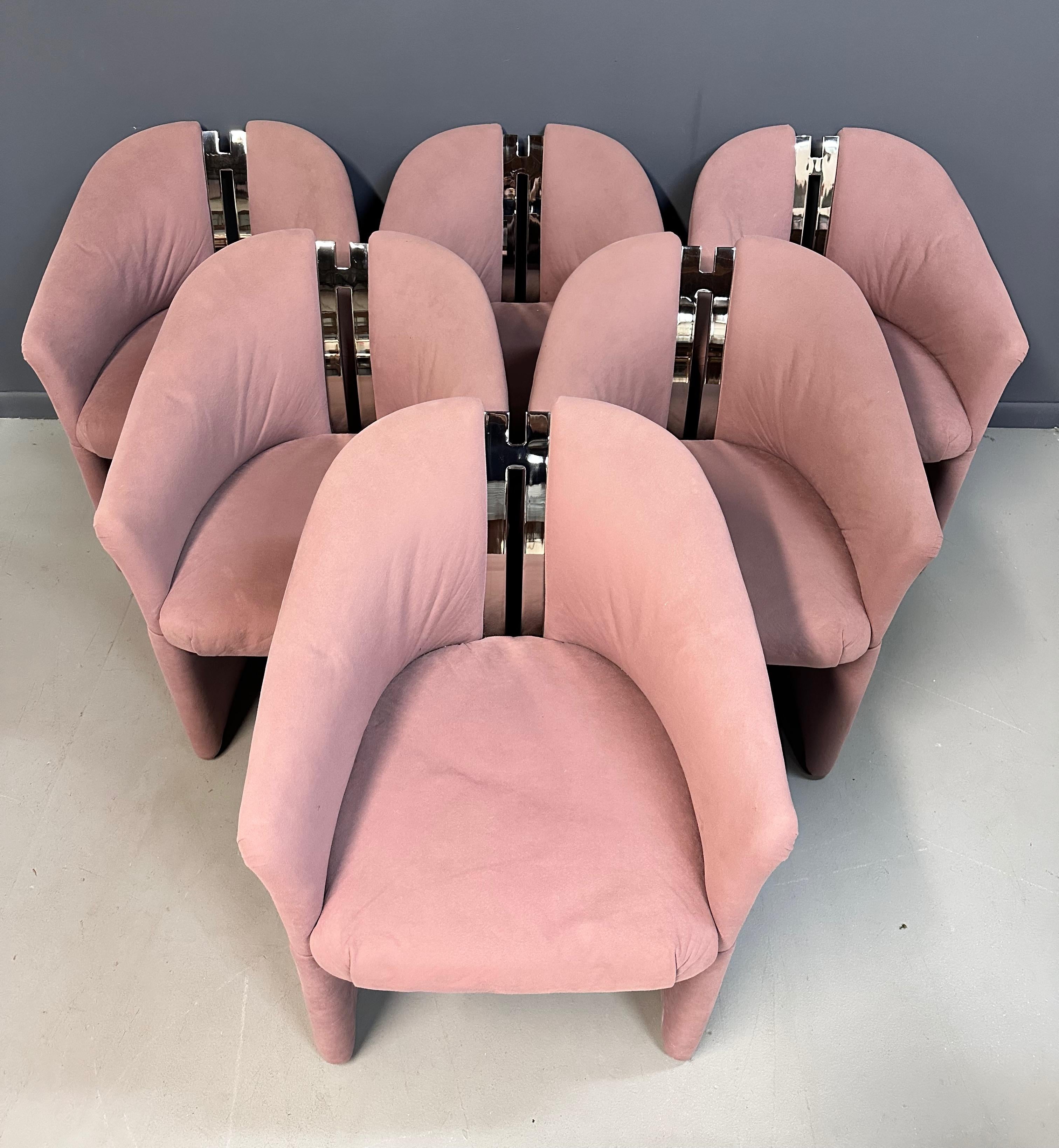 Upgrade your home with this set of luxurious Post Modern barrel back armchairs featuring chrome accents inspired by iconic designer Pierre Cardin. Experience sophistication, comfort, and style all in one with these high-quality chairs from Carsons.