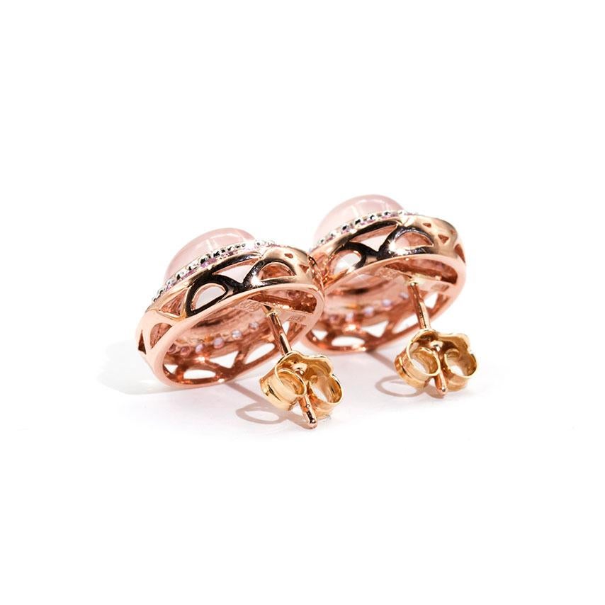 Contemporary 6-Ray Star Rose Quartz Oval Cabochon and Pink Sapphire 9 Carat Rose Gold Studs