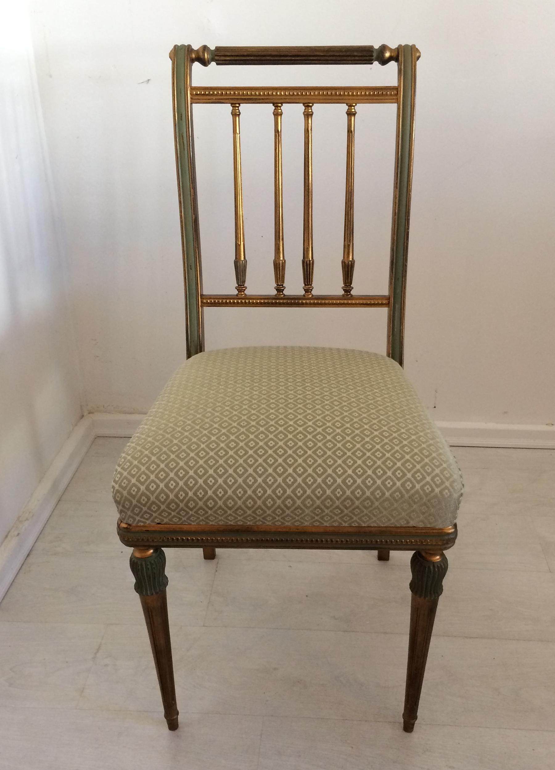 Green with gold highlights painted finish which appears to be the original finish. Fabric is in very good usable condition. Nice clean set of chairs ready to be used. 36 inches high by 18.5 deep by 18 wide seat height is 19.5 inches.
 