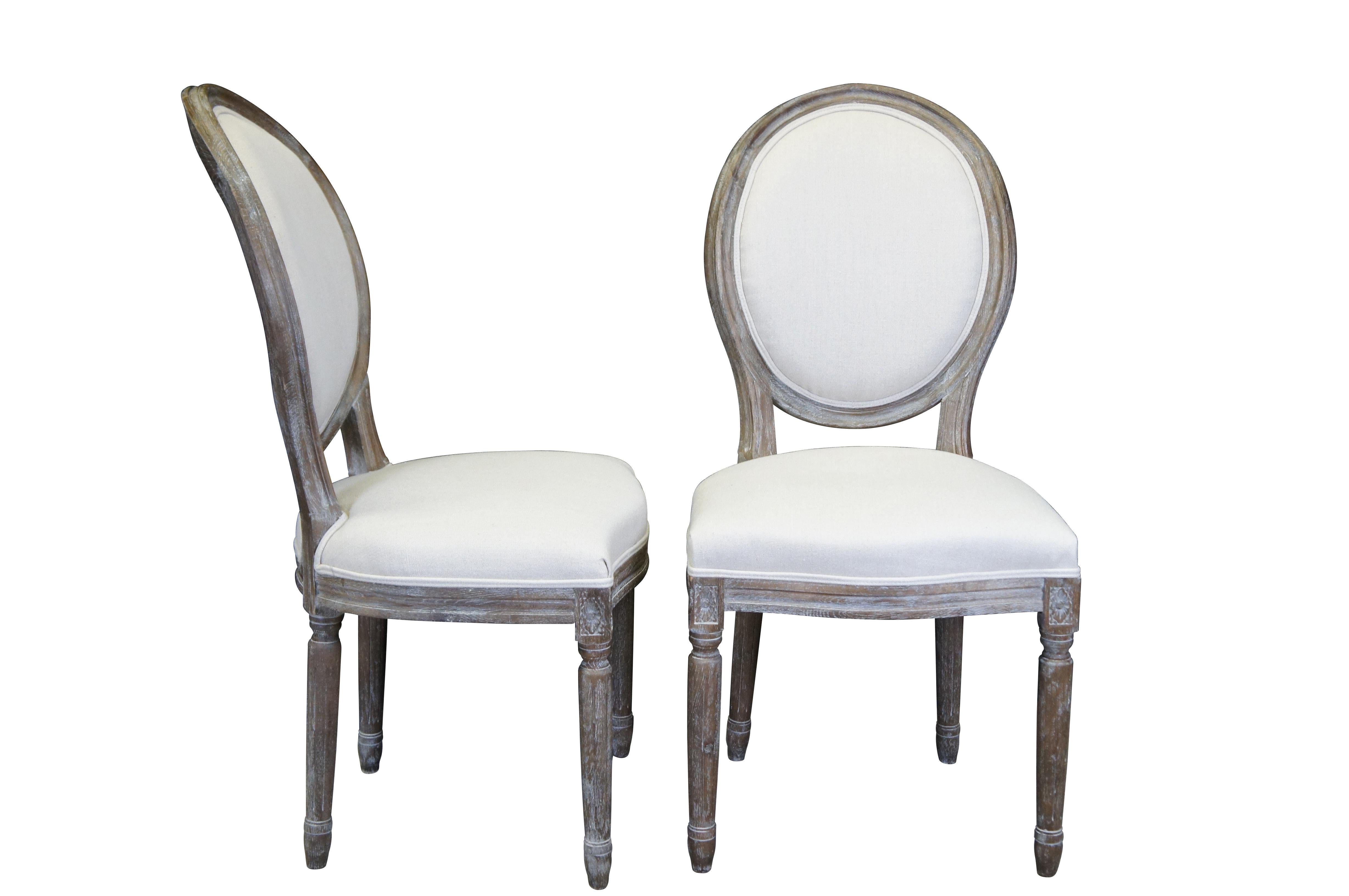 Set of six vintage Restoration Hardware oak dining chairs featuring French Country / Tuscan styling and finished in a natural limed white wash with Belgian linen upholstery.

Dimensions:
23