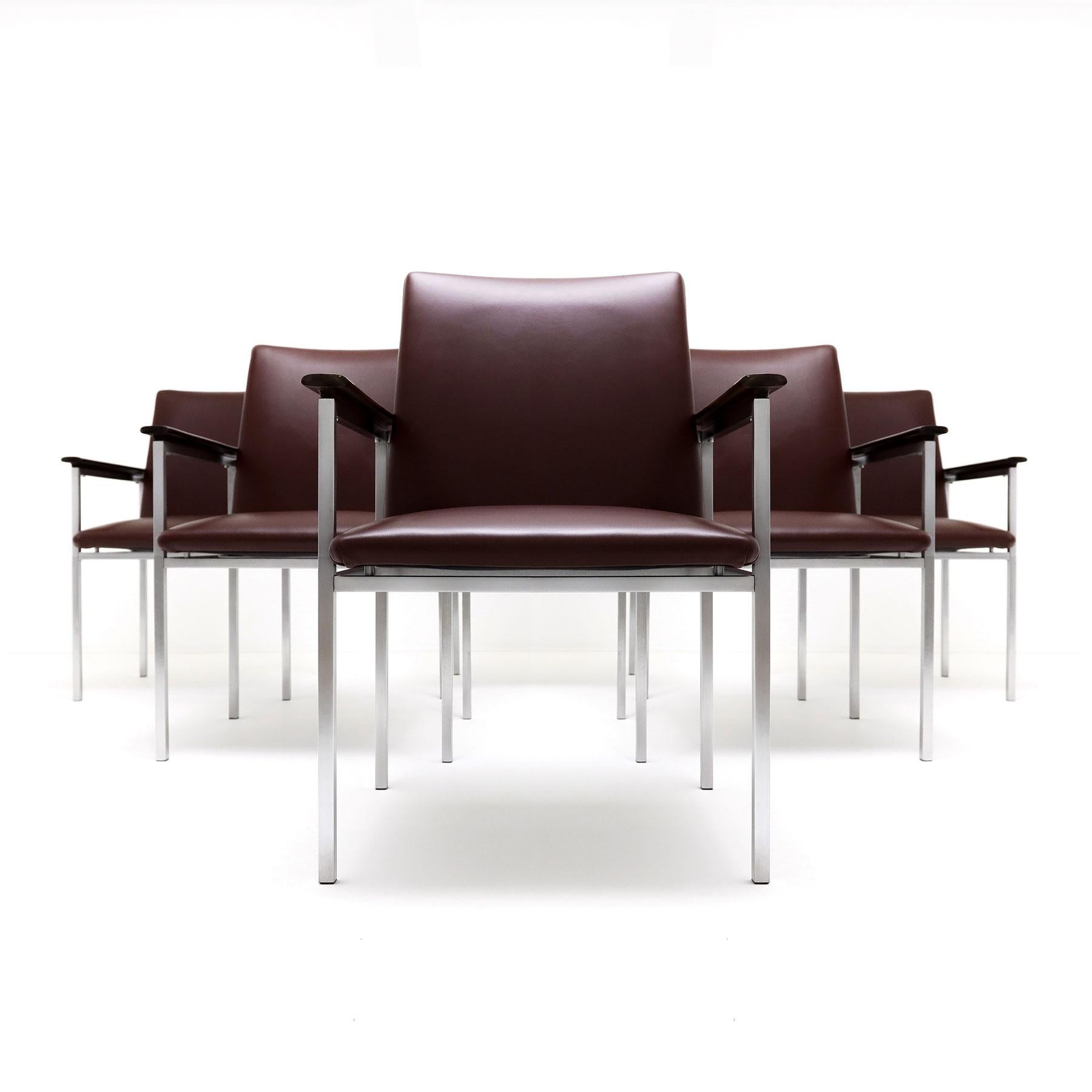 A rare complete set of  6 Sigvard Bernadotte H-line Danish armchairs in dark burgundy leather with brushed steel frames and solid Walnut arms for France & Son.

Designed in the 1960s by the renowned Swedish designer Sigvard Bernedotte the H-line