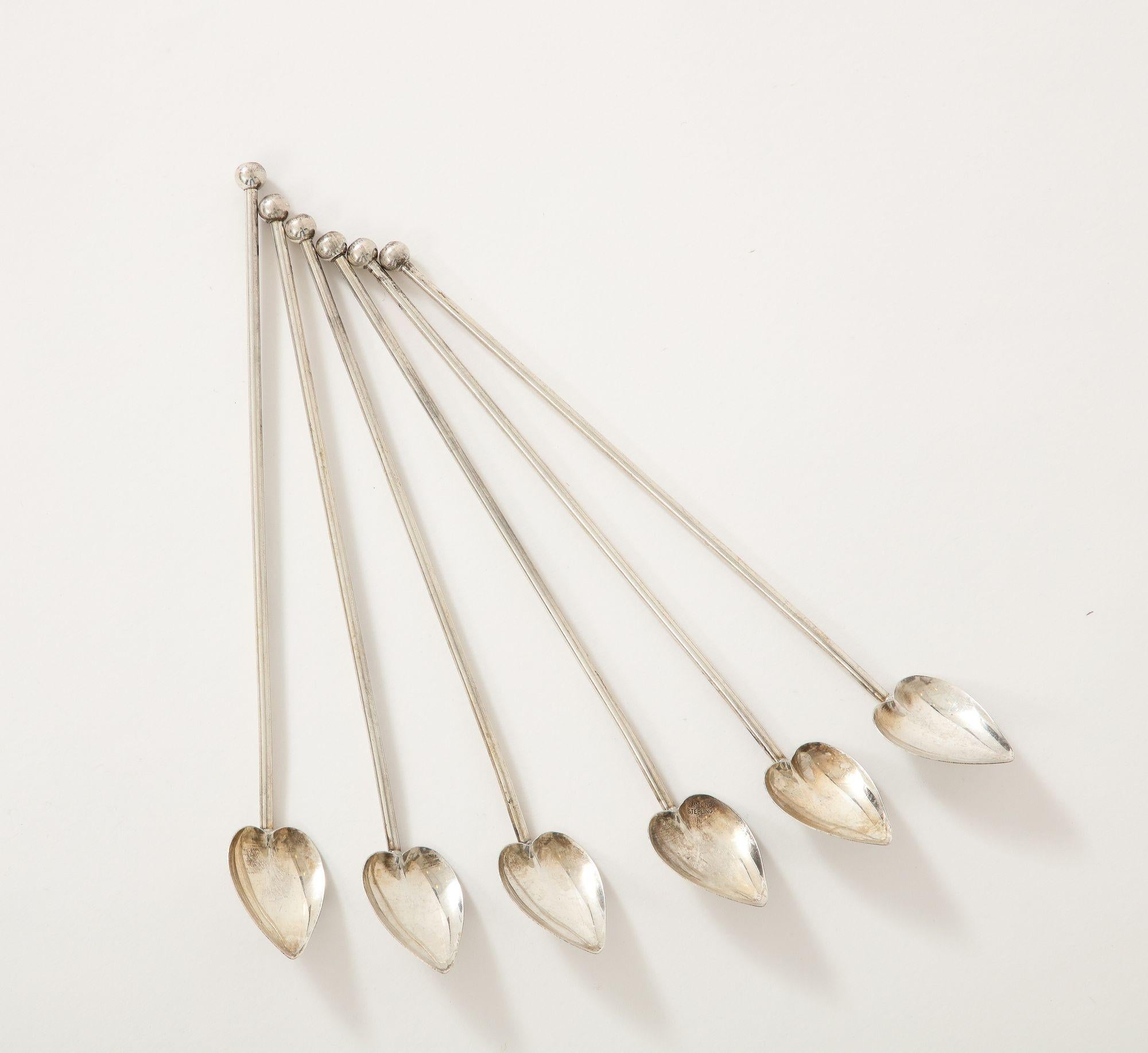 A set of 6 practical sterling silver heart shaped cocktail spoons/straws. These stirrers are a great complement to any cocktail party.