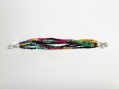 Bracelet à 6 rangées de rubis, émeraudes, saphirs et fermeture magnétique en argent