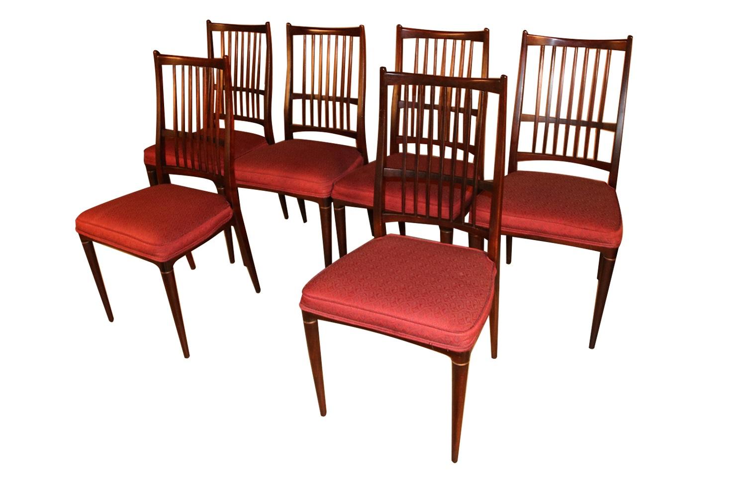 A set of 6 beautiful Mid-Century Modern rosewood “Cortina” dining chairs designed by Svante Skogh for Seffle Möbelfabrik made in Sweden. A spectacular vintage set of 6 armless rosewood dining chairs featuring a gently arched and sculpted rosewood