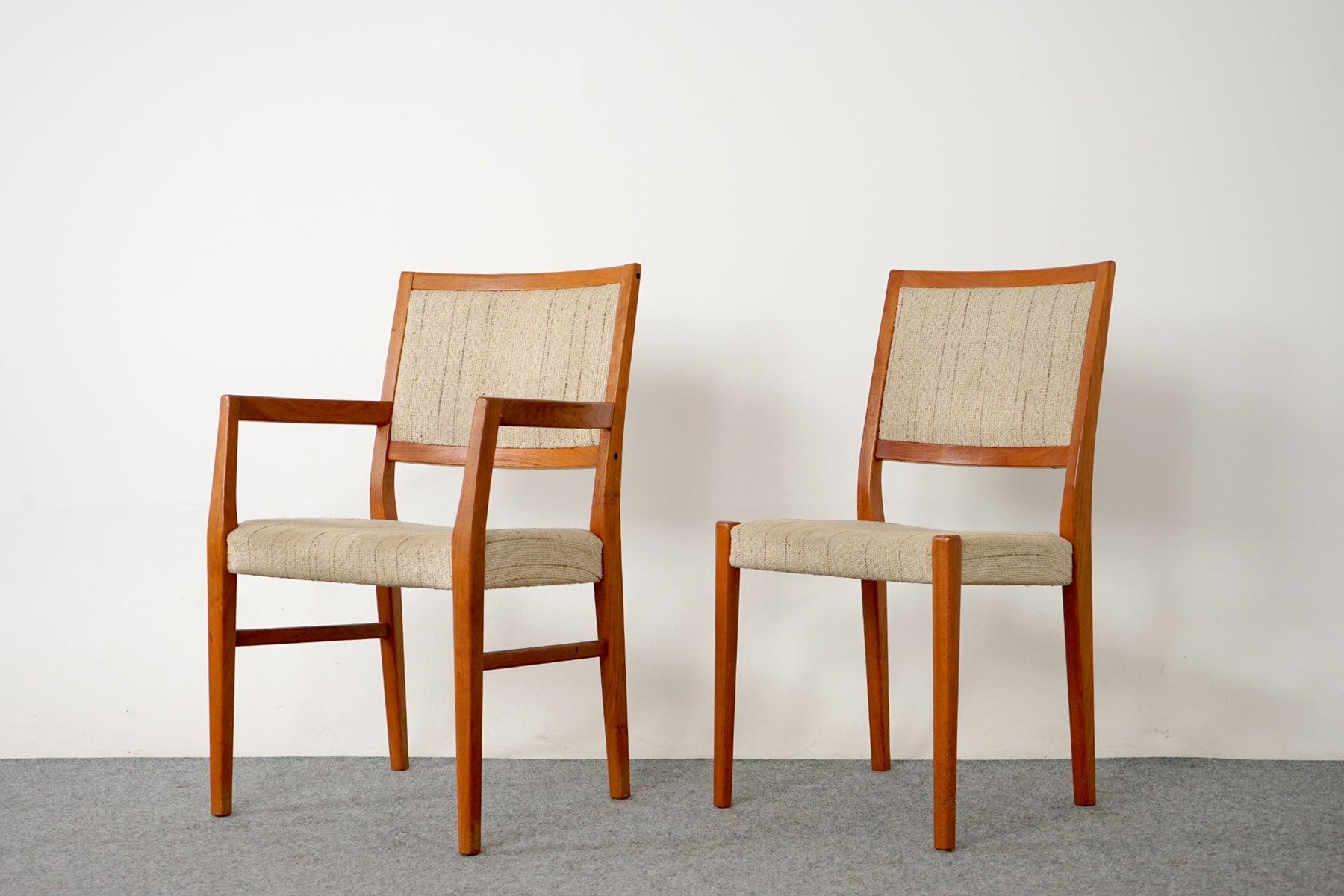 Teak dining chairs, by Svegards Markaryd, circa 1970's. Beautifully curved backrests and generous seat design provide support and comfort. Solid wood legs feature cross braces for added stability and support. Set includes one captain's chair, 5 side