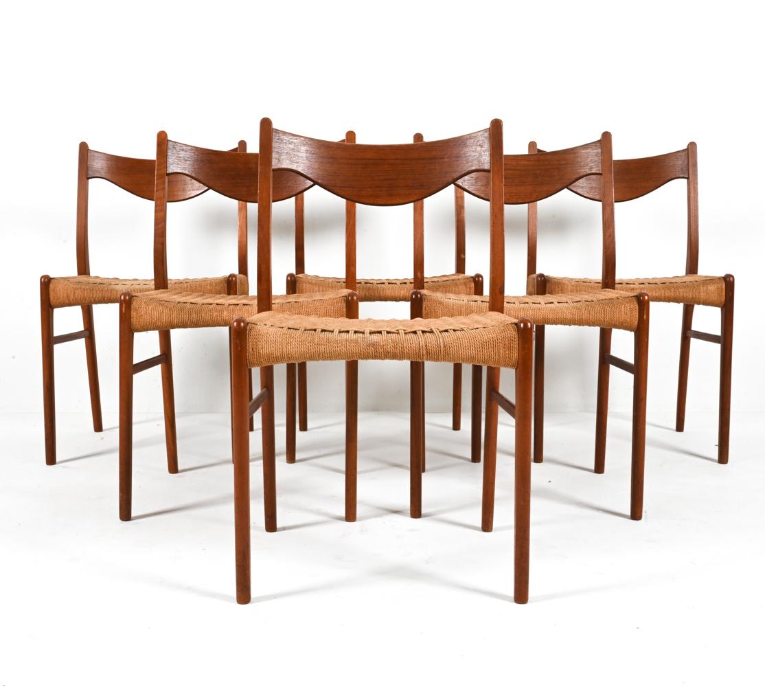 Curate Mid-Century elegance in your dining space with this exceptional set of (6) side chairs in solid teak wood, designed by Arne Wahl Iversen for Glyngøre Stolefabrik. In this beautiful set, the graceful swag-like curves of the backrests elevate