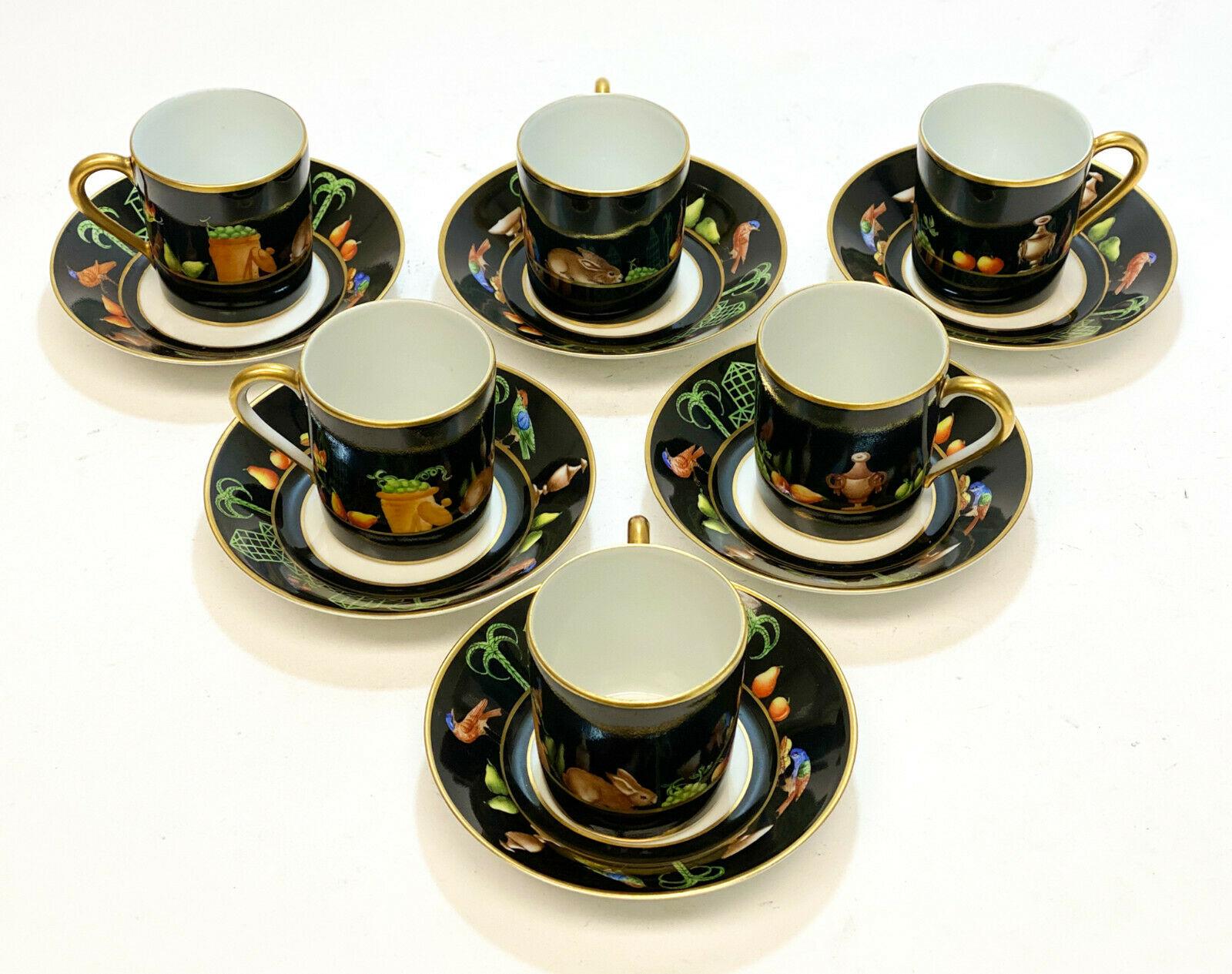 6 Tiffany Private Stock Le Tallec porcelain cup and saucers in Black Shoulder . Beautiful hand painted tropical birds, trees, fruits, and rabbits to a black and gilt ground. Tiffany Private Stock mark with the Le Tallec mark and artist initials to