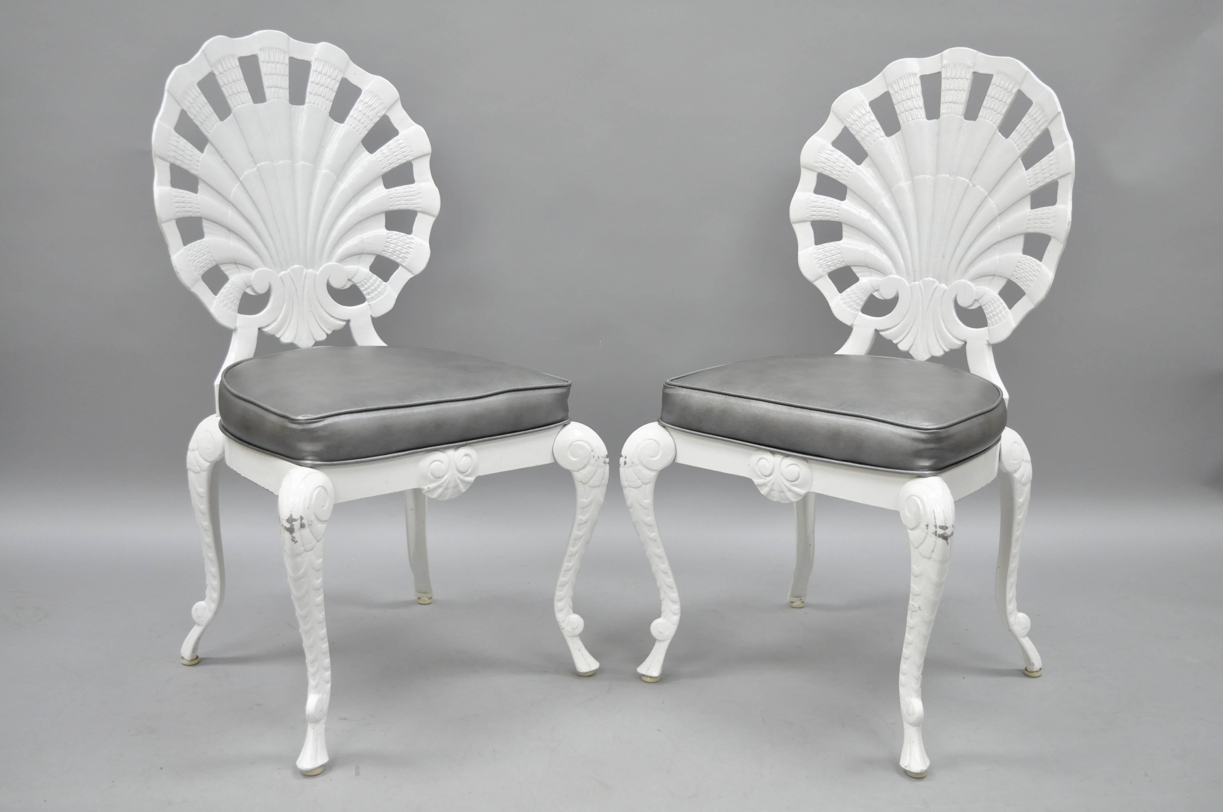 Set of six vintage fan or shell back Grotto style dining chairs by Tropitone. Item features fan or shell form backs, cast aluminium construction, silver vinyl upholstery, original white finish, quality American craftsmanship, Mid-Late 20th Century.