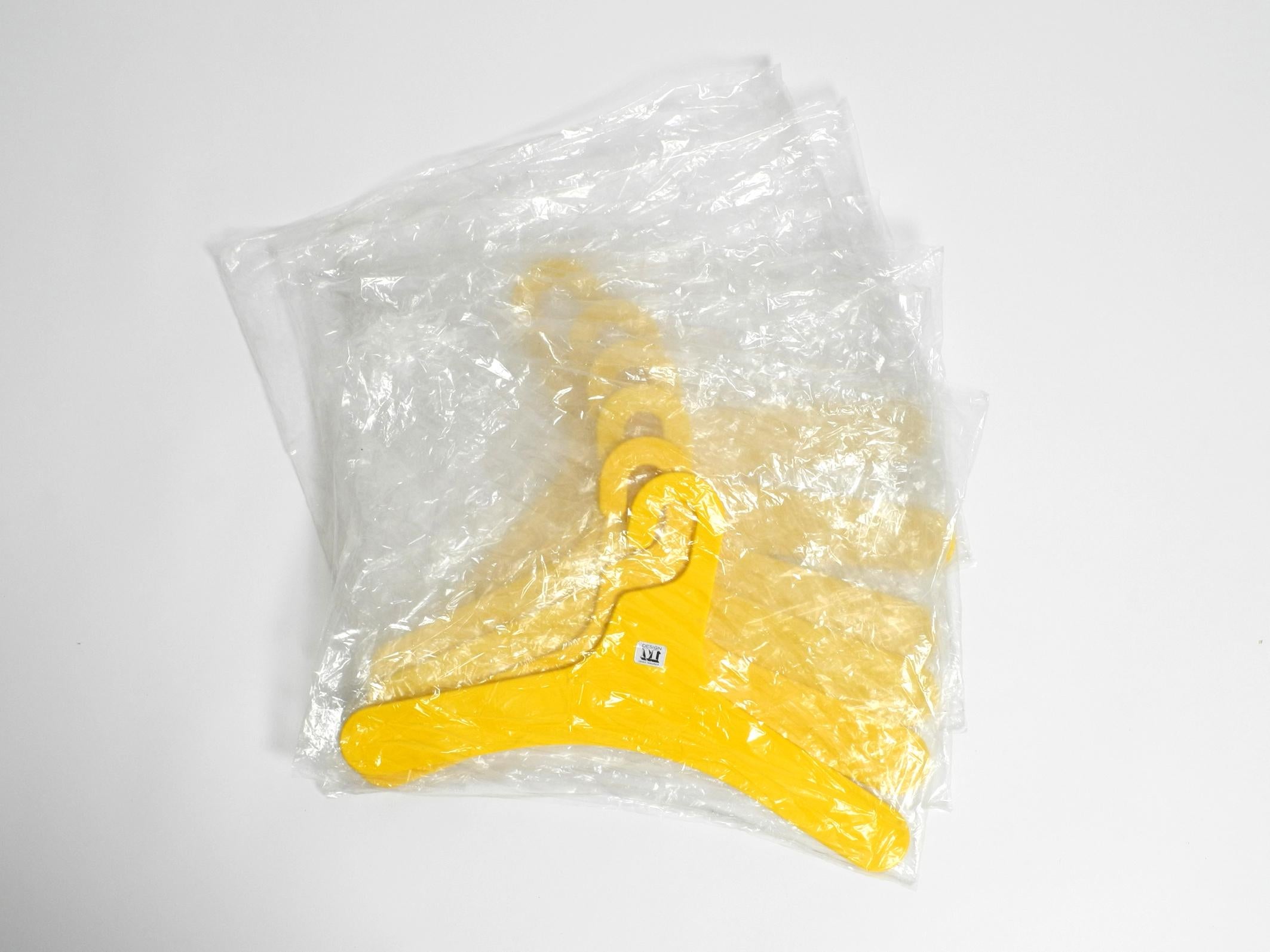 6 unused 1970s yellow and green plastic hangers by Ingo Maurer for Design M 1