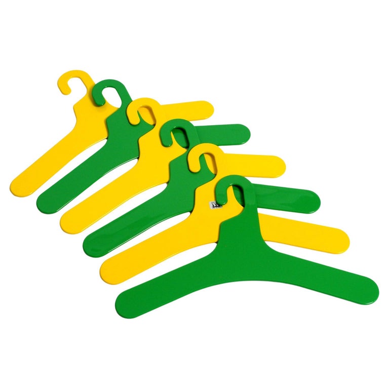 6 unused 1970s yellow and green plastic hangers by Ingo Maurer for