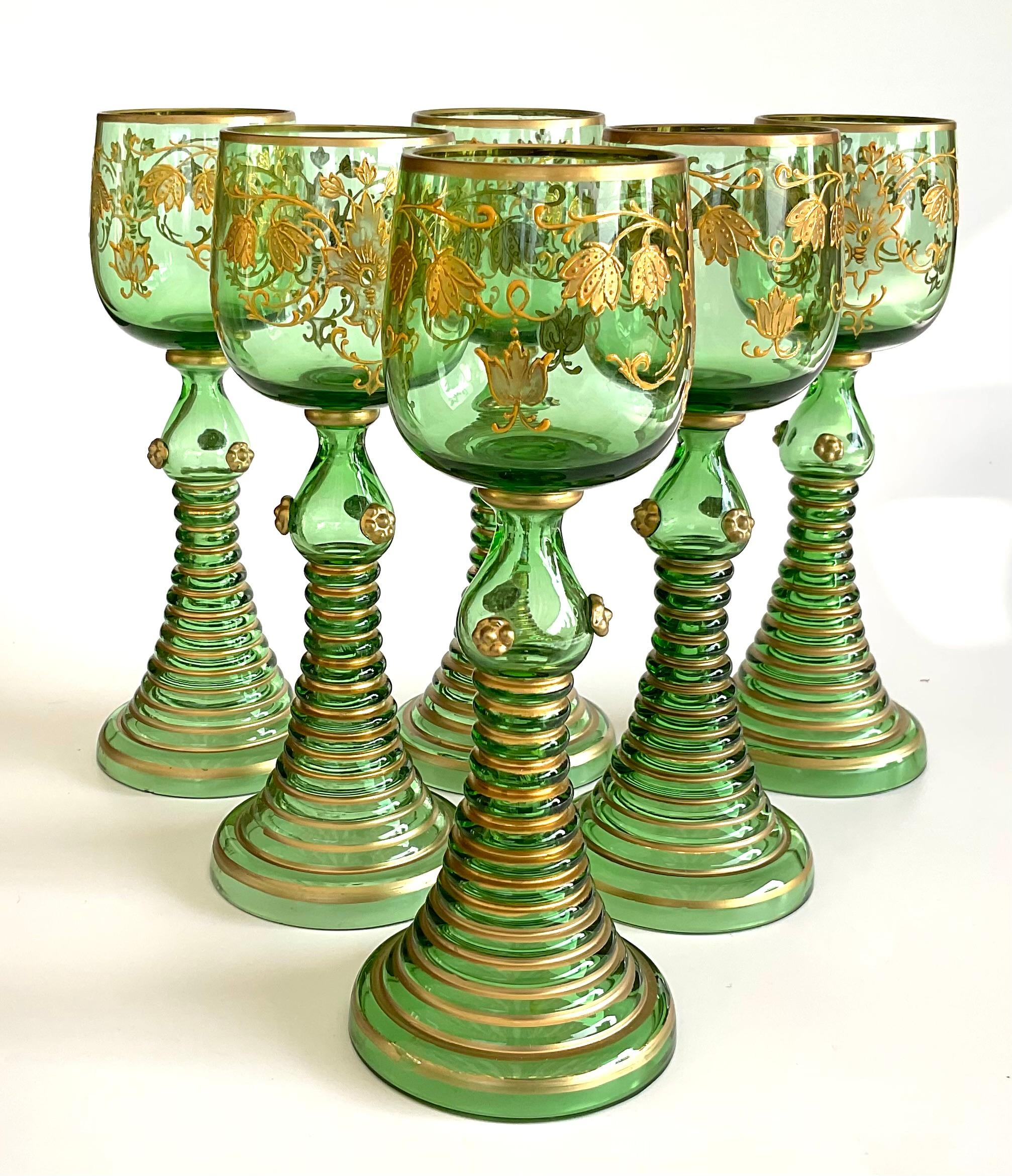 6 green with gold gilt decoration Moser glasses With a very appealing form. 