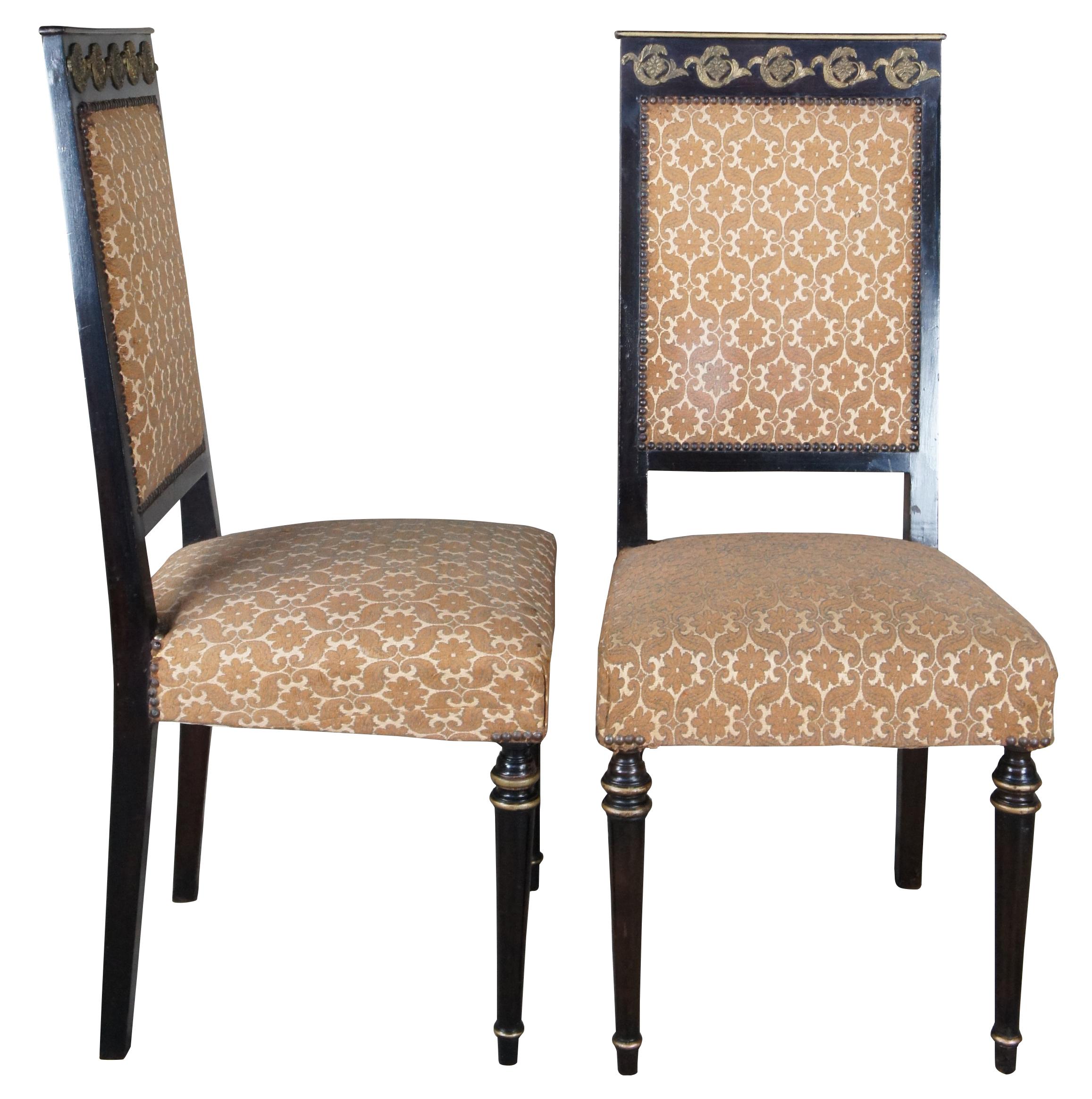 Vintage set of six French Louis XVI inspired dining chairs. Made in Cairo Egypt (Arabska Republika Egiptu) by Abbas, circa 1972. Made of ebonized wood featuring ornate brass medallions with floral upholstery, nailhead trim, and gold banding.
 