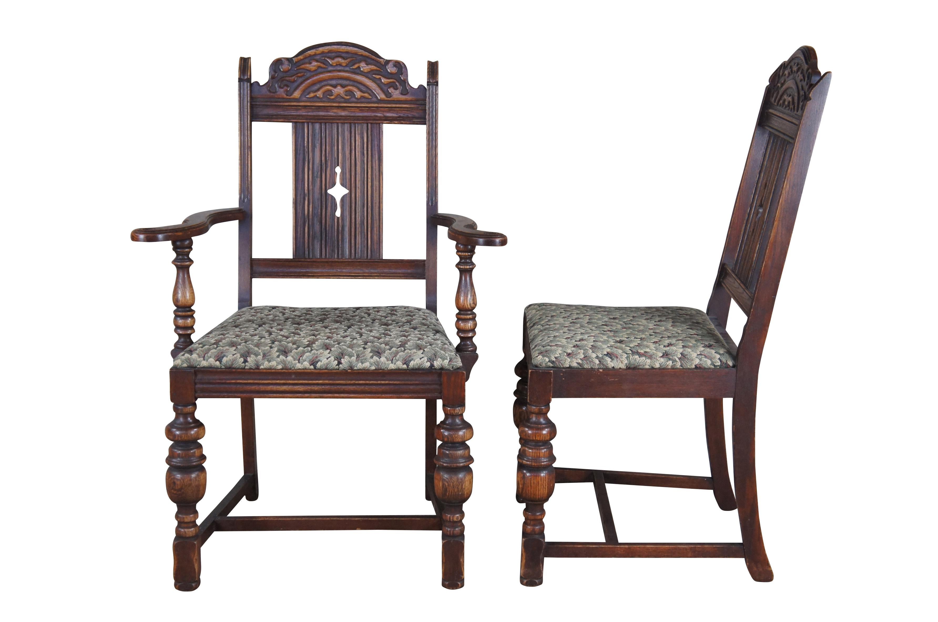 Set of 6 Vintage Jacobean style Dining Chairs by Bernhardt Furniture, circa 1930-40s.  Features a carved crest rail over a pierced diamond linen fold splat. The chairs are upholstered in a floral leaf / tree pattern and supported by baluster turned