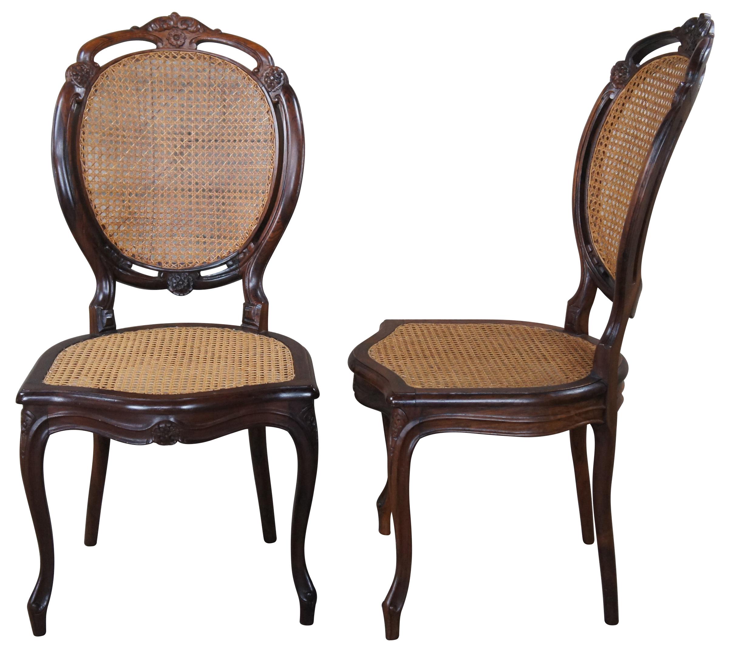 6 Mid 20th century Louis XV style balloon back dining chairs.  Made from hardwood with cane back and seat.  Features a pierced and carved seat back over cabriole legs. 
