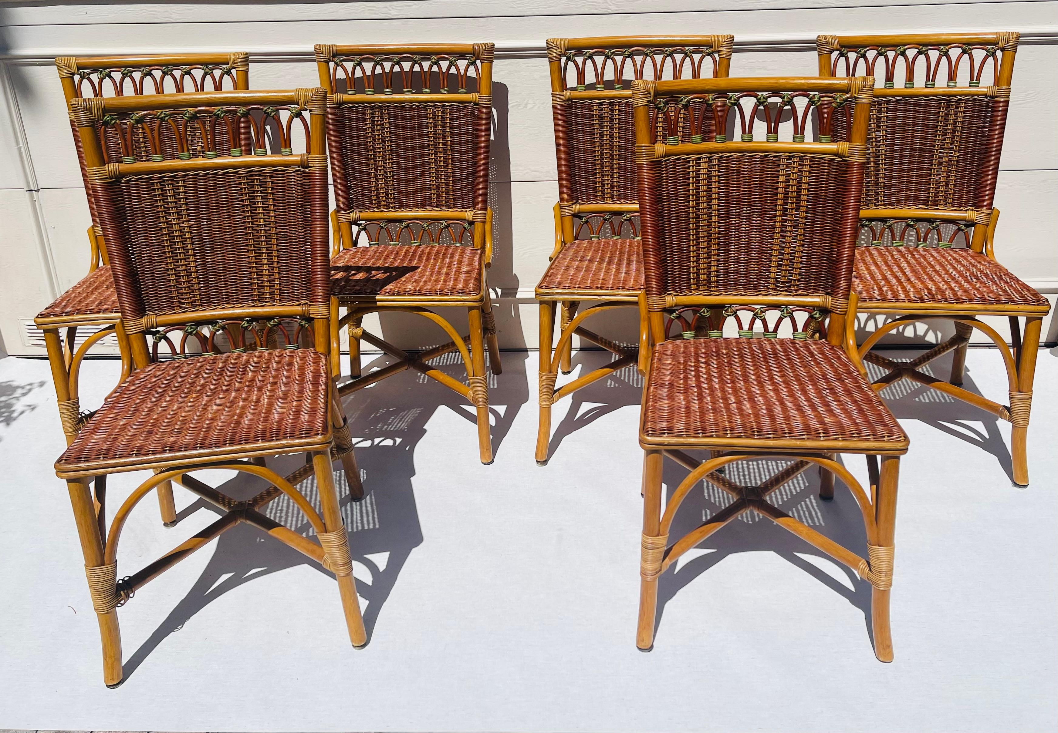 Vintage McGuire dining chairs set of 6 chairs. Made of woven rattan on. Bamboo bases. 4 brocade cushions s available.