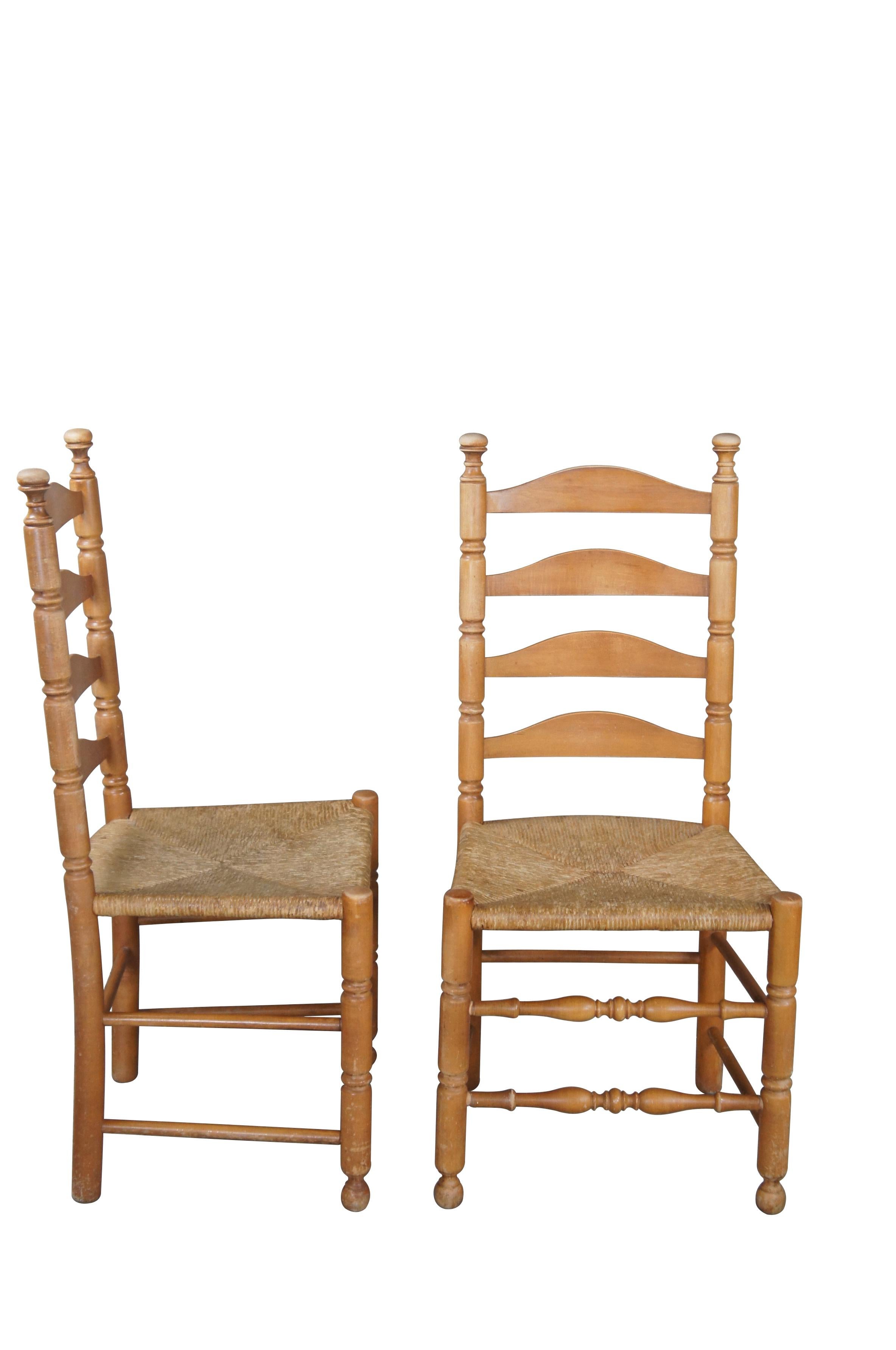 6 Shaker style ladderback dining chairs, circa second half 20th century.  Made from maple with an arched ladderback and rush seat.  The chairs are supported by ribbed front legs with turned stretchers in between.  

Dimensions:
19.5