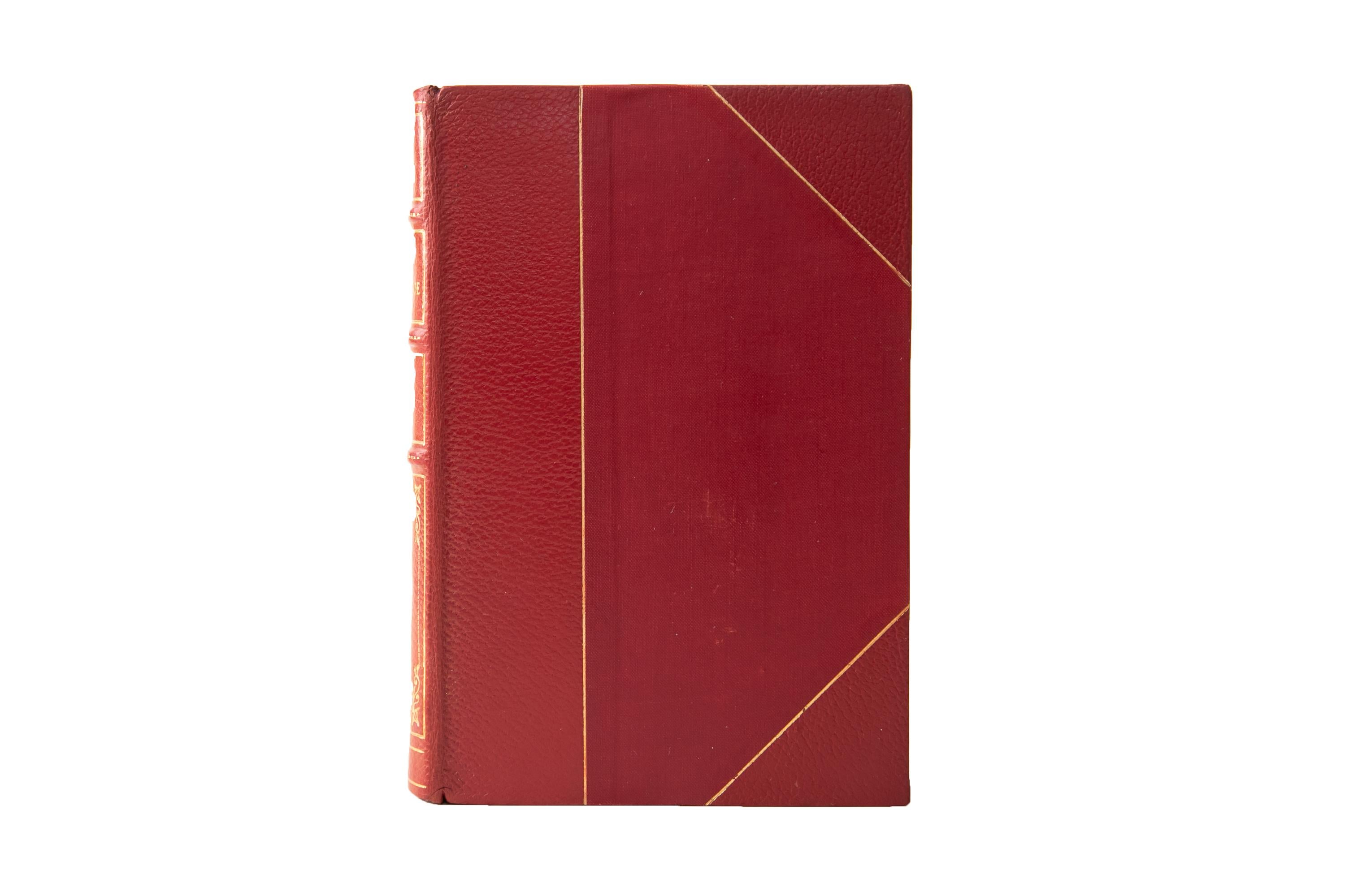 6 Volumes. Edgar Allan Poe, The Complete Works. Bound in 3/4 red morocco and linen boards, bordered in gilt-tooling. The spines display raised bands, bordering, floral panel detailing, and label lettering, all gilt-tooled. The top edges are gilded