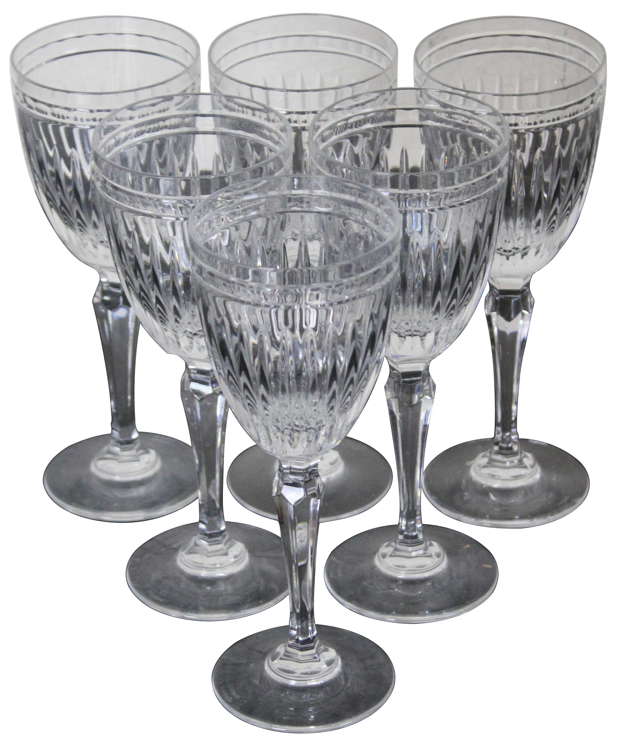 The Hanover pattern features a regular size cut stem with a smooth base (many Waterford pattern have a cut/etched design on the base) and a vertical cut paneled design with banding on the goblet portion. Measures: 8