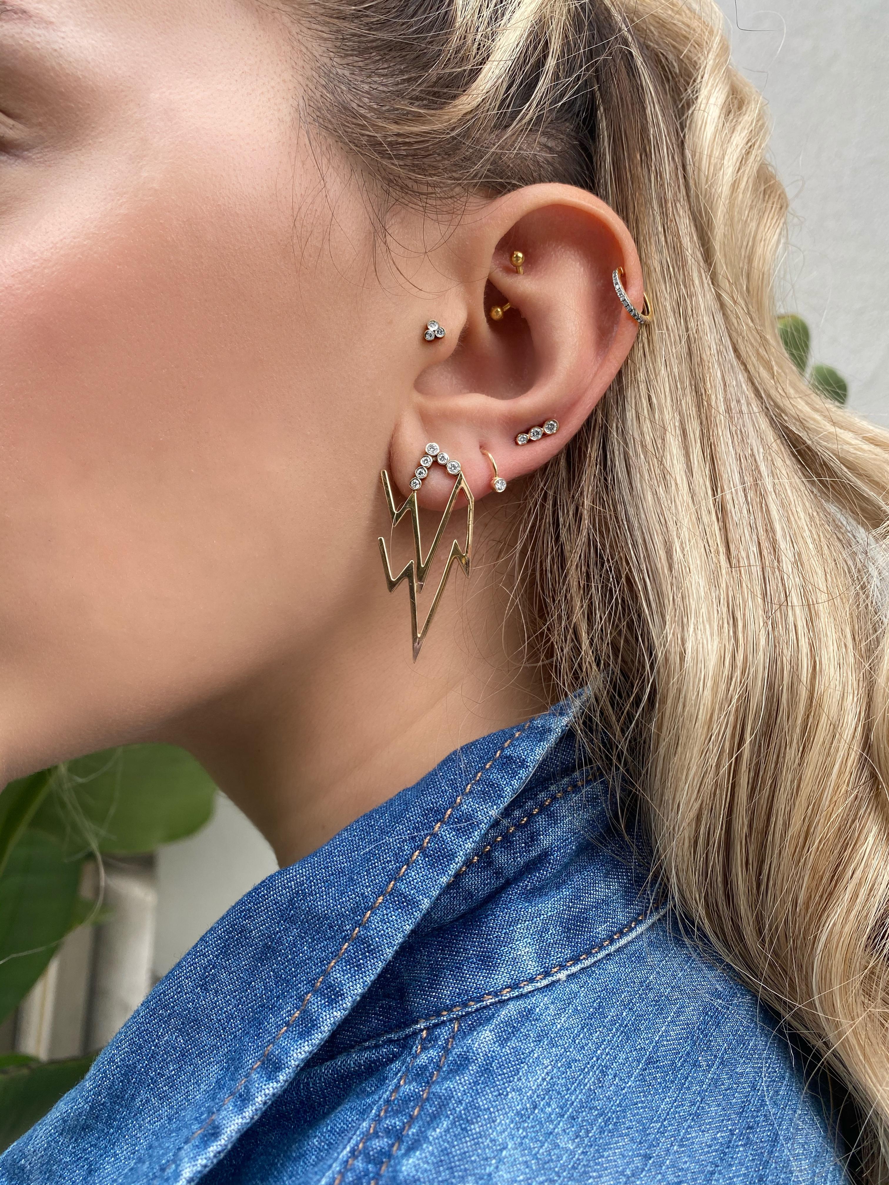 The Thunder Collection represents the power within yourself as the lightning design has always had a deep and strong meaning in history and legends. 

6 White diamond lightning earrings in 14k rose gold by selda jewellery

Additional