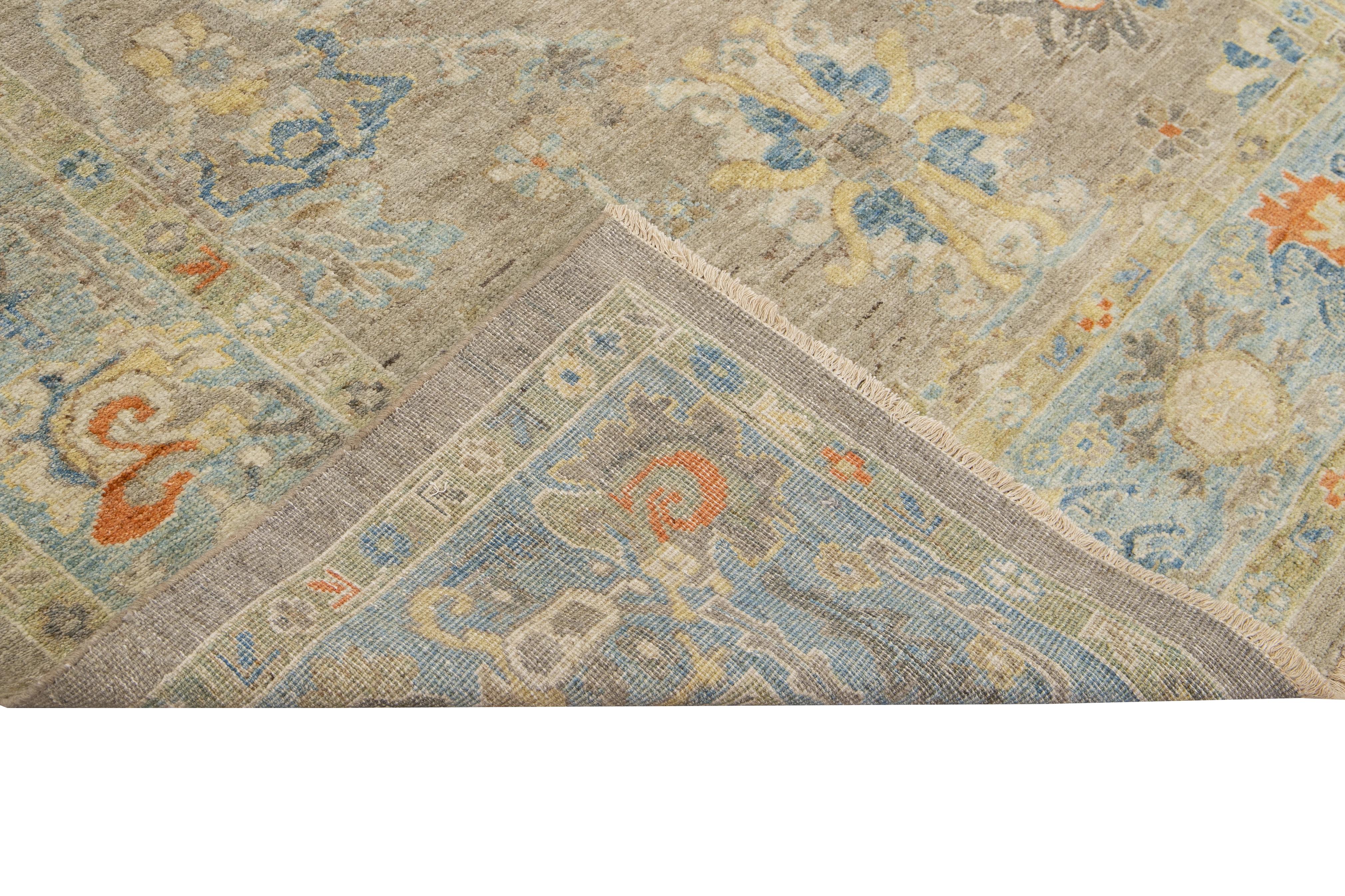 This beautifully handwoven oriental rug, featuring a classic central medallion and intricate floral and geometric patterns. The muted tones of beige, blue, orange, and soft yellow create a warm, inviting palette that complements both traditional and