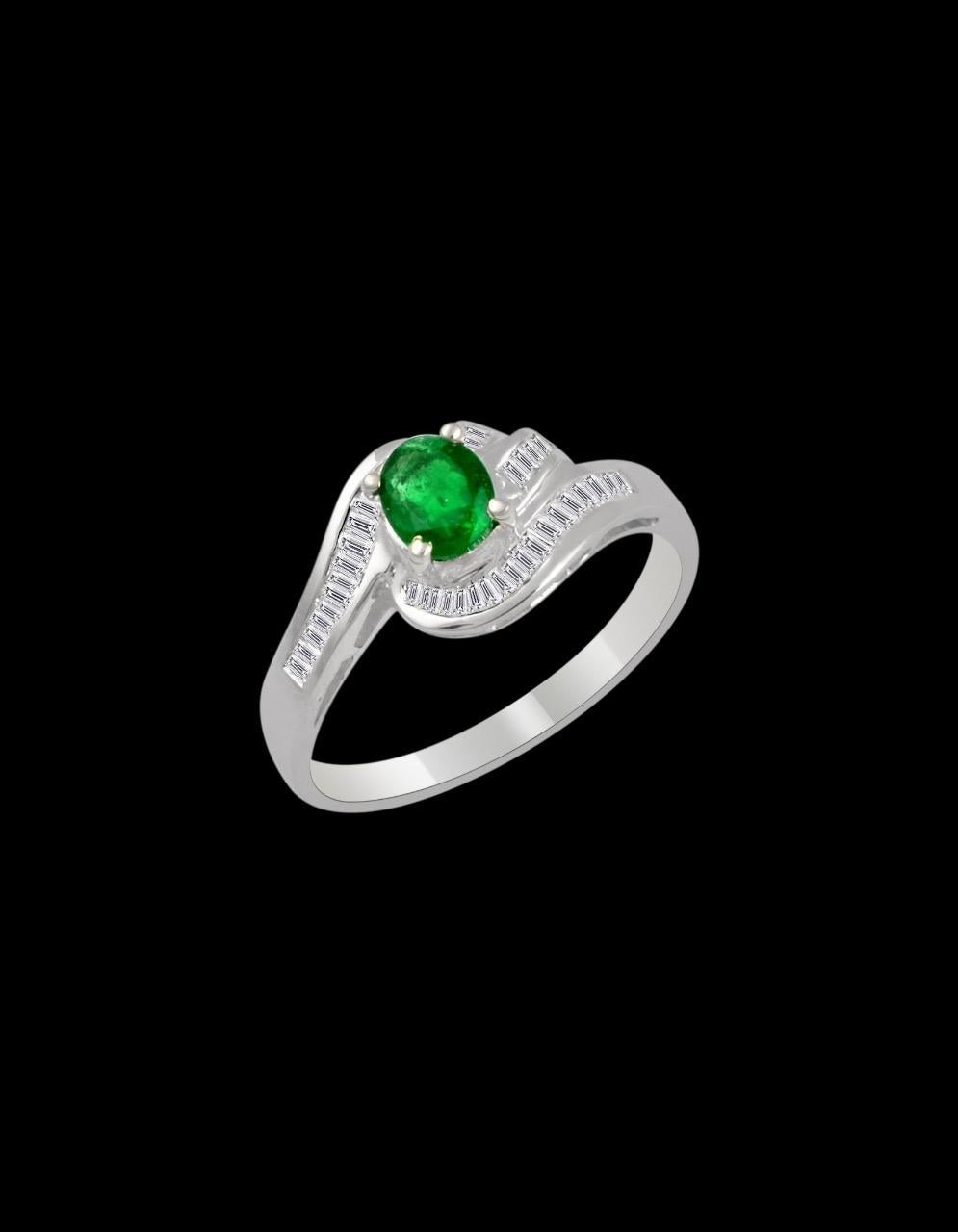 Extreme fine quality of emerald , small size but beautiful 
6 X 5 mm emerald , Oval in shape 
Intense green color, Beautiful stone with shine and luster 
Total Diamond weight Approximately 0.5 Ct
Setting is very nice 
 Emeralds are very precious ,