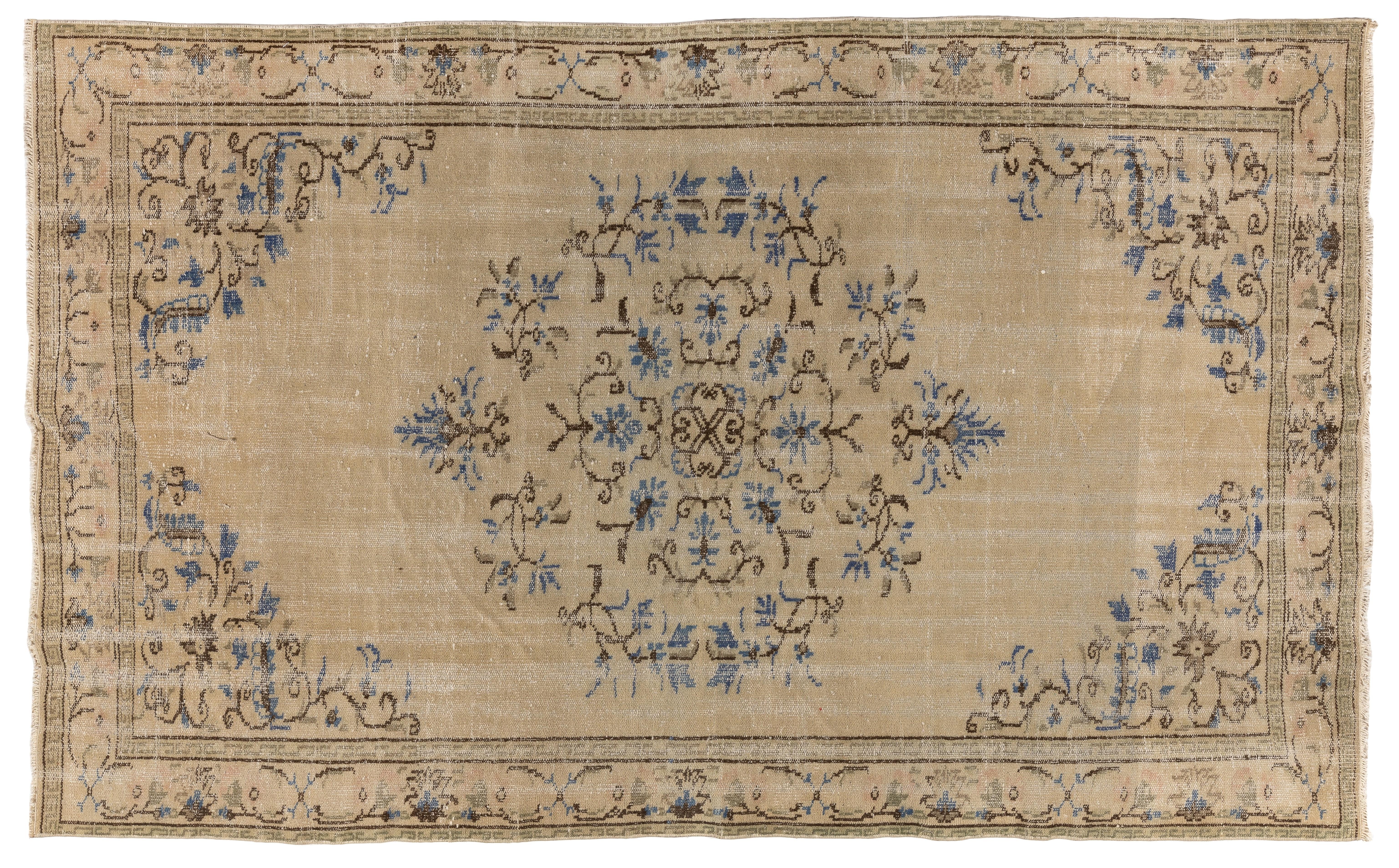 A fine vintage hand knotted Turkish Oushak rug from the 1950s. Measures: 6 x 9 Ft.
Finely hand knotted with low wool pile on cotton foundation, the rug is in good condition, sturdy and clean.