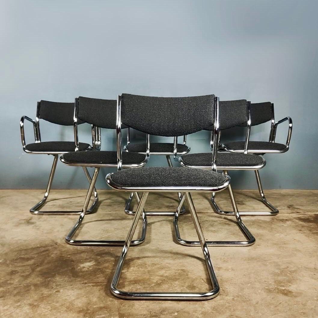 New Stock ✅

6 x Charcoal Black Grey Bouclé Mid Century Chrome Dining Chairs

These 6 vintage chrome dining chairs, feature 2 carvers with armrest and 4 without armrests. 

Newly upholstered in a charcoal grey black bouclé on a chrome tubular