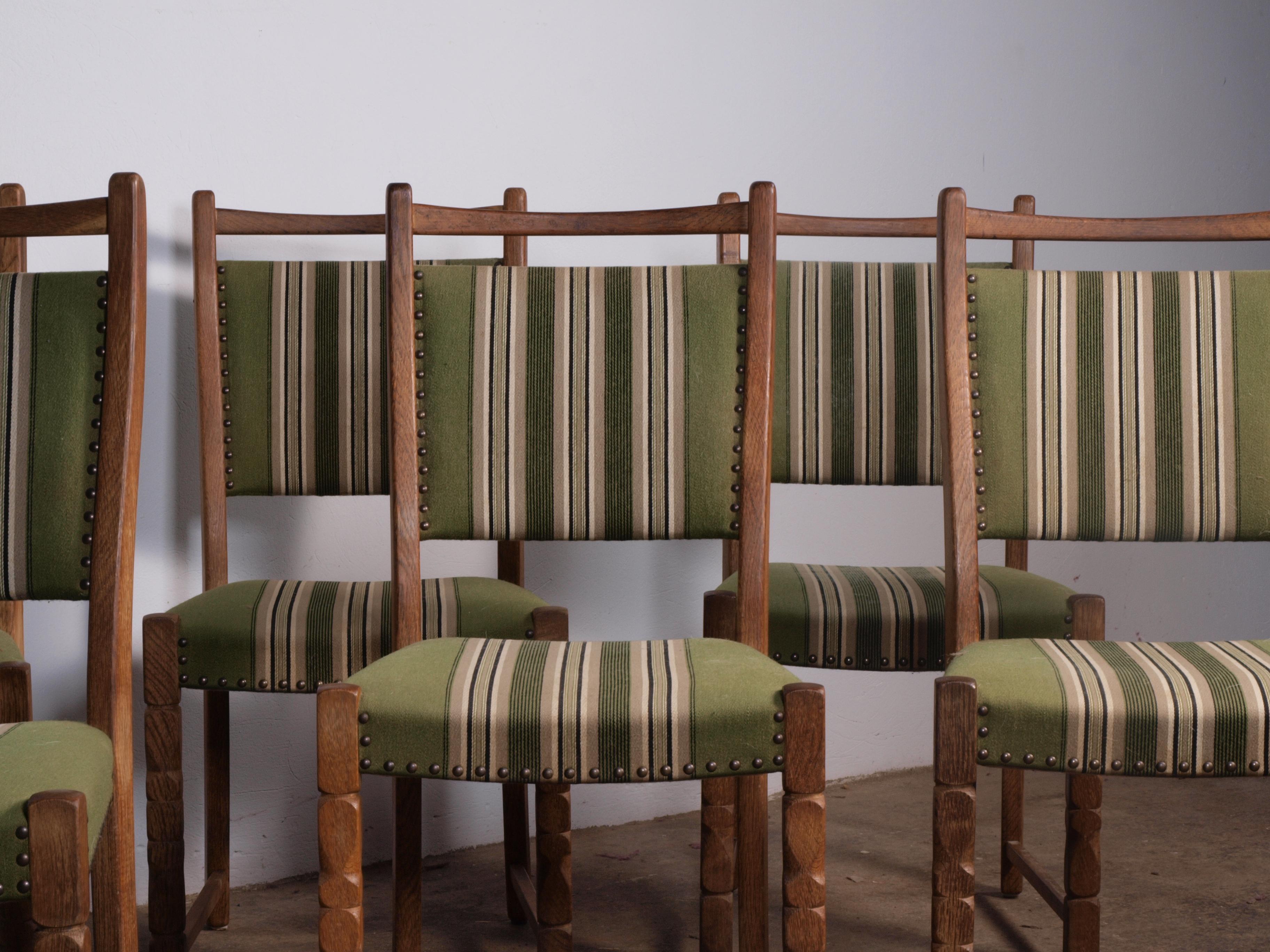 6 vintage oak dining chairs in the style of Henning Kjærnulf. They are for sure made in Denmark in the same period in the 1960s. They are all solid and no damage in the wood.

They need reupholstery. They will have patina as shown in the pictures.